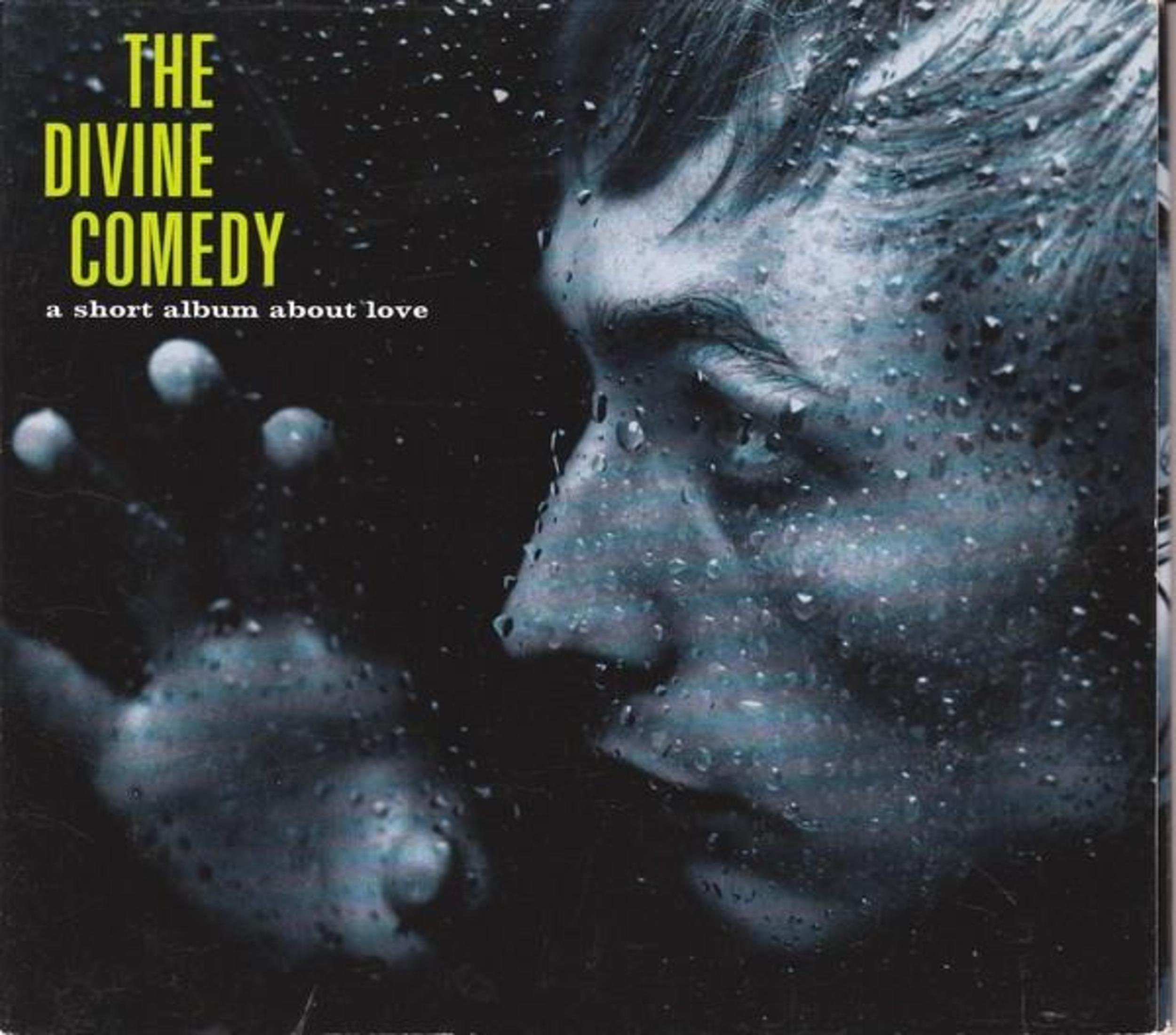 La copertina mostra "The Divine Comedy" con gocce di pioggia.