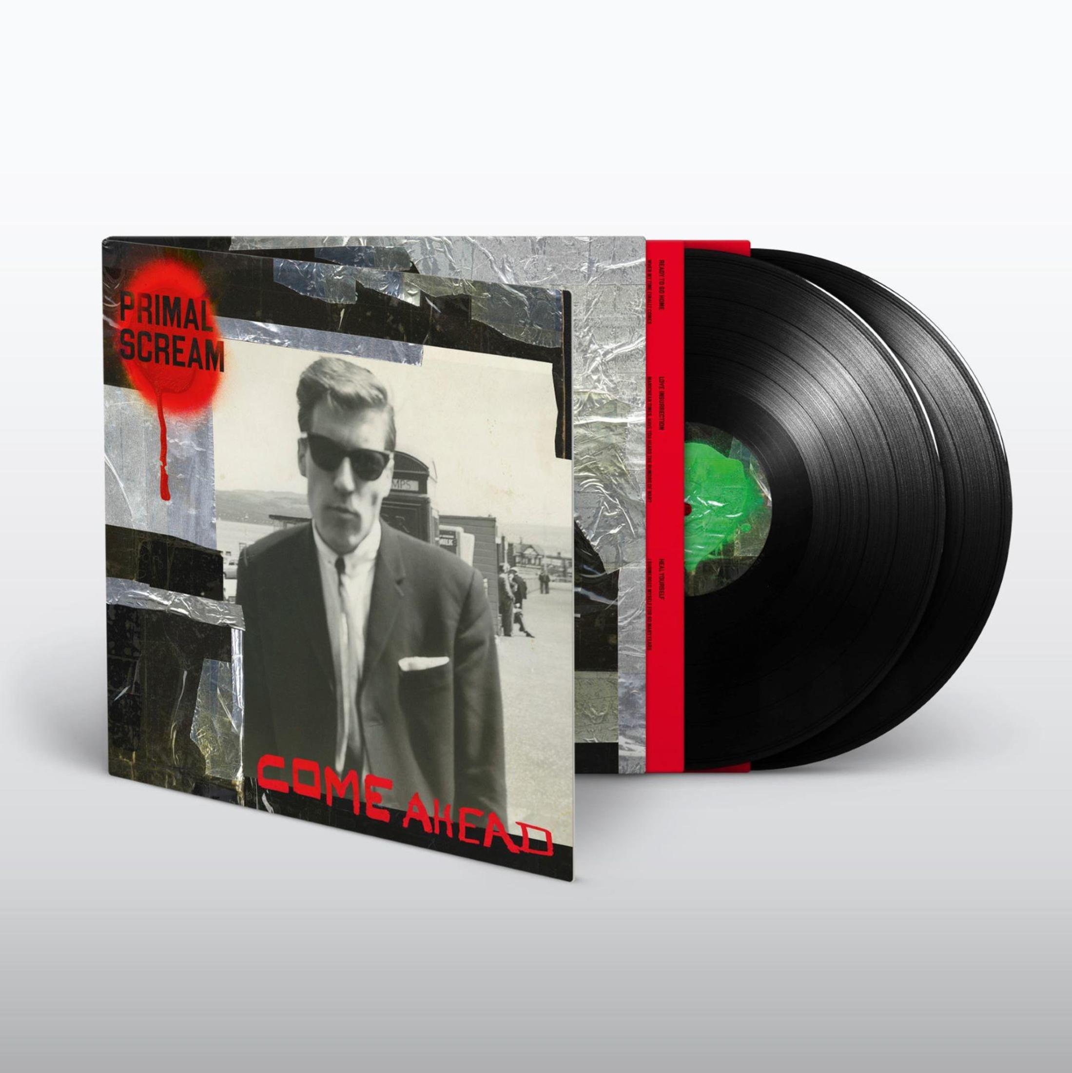 Copertina disco con uomo in occhiali da sole, due dischi in vinile neri.