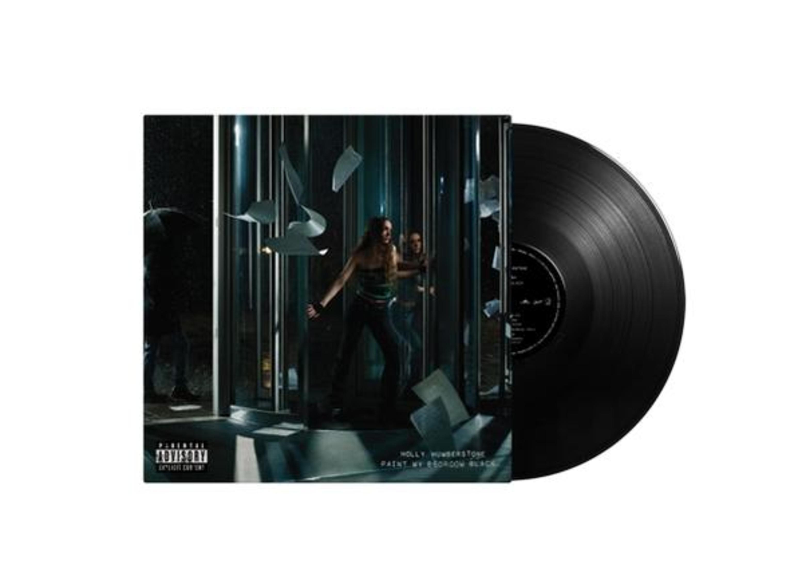 Disco in vinile con copertina: donna tra pannelli di vetro, carte volanti.