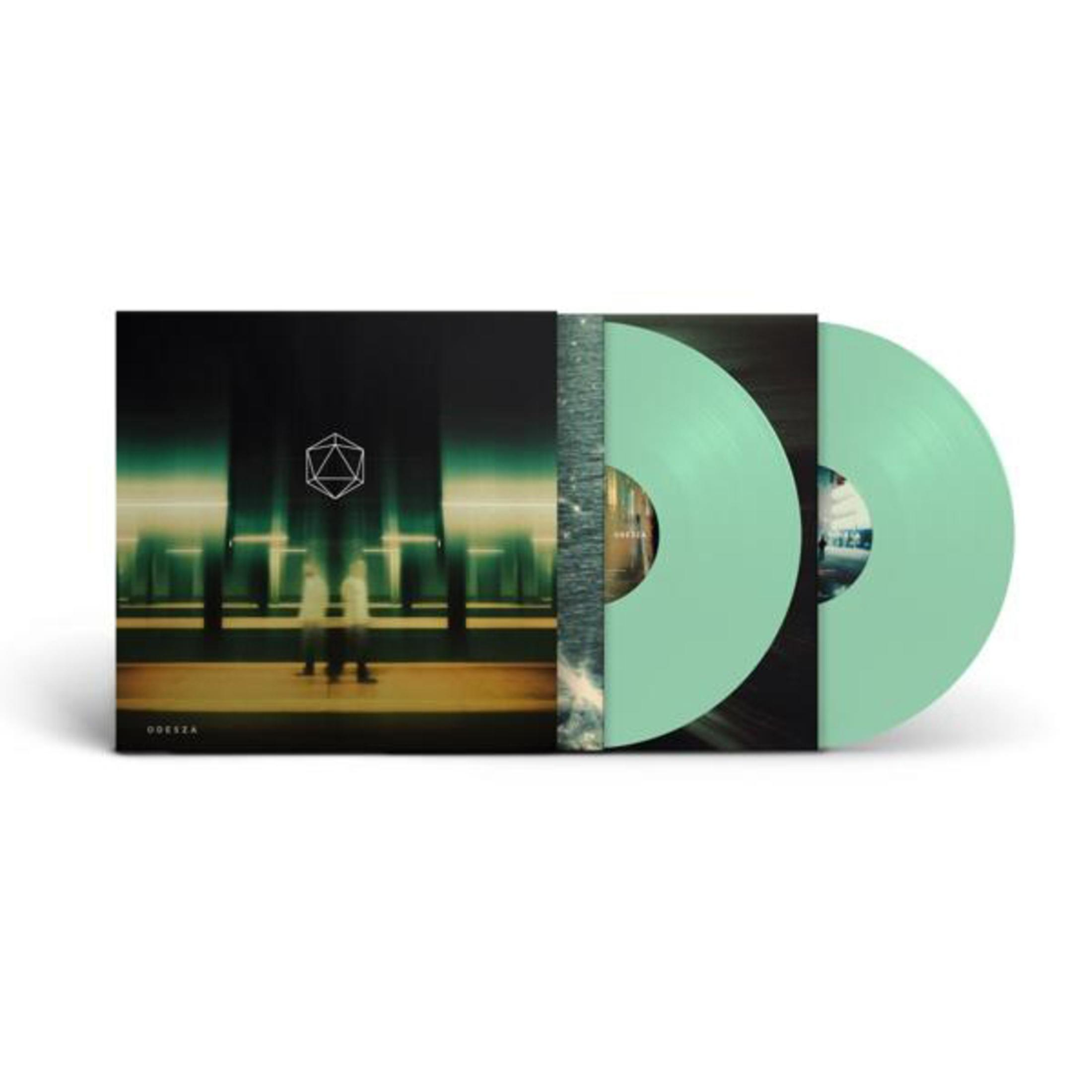 Un album in vinile verde menta con copertina nero e verde, due dischi visibili.