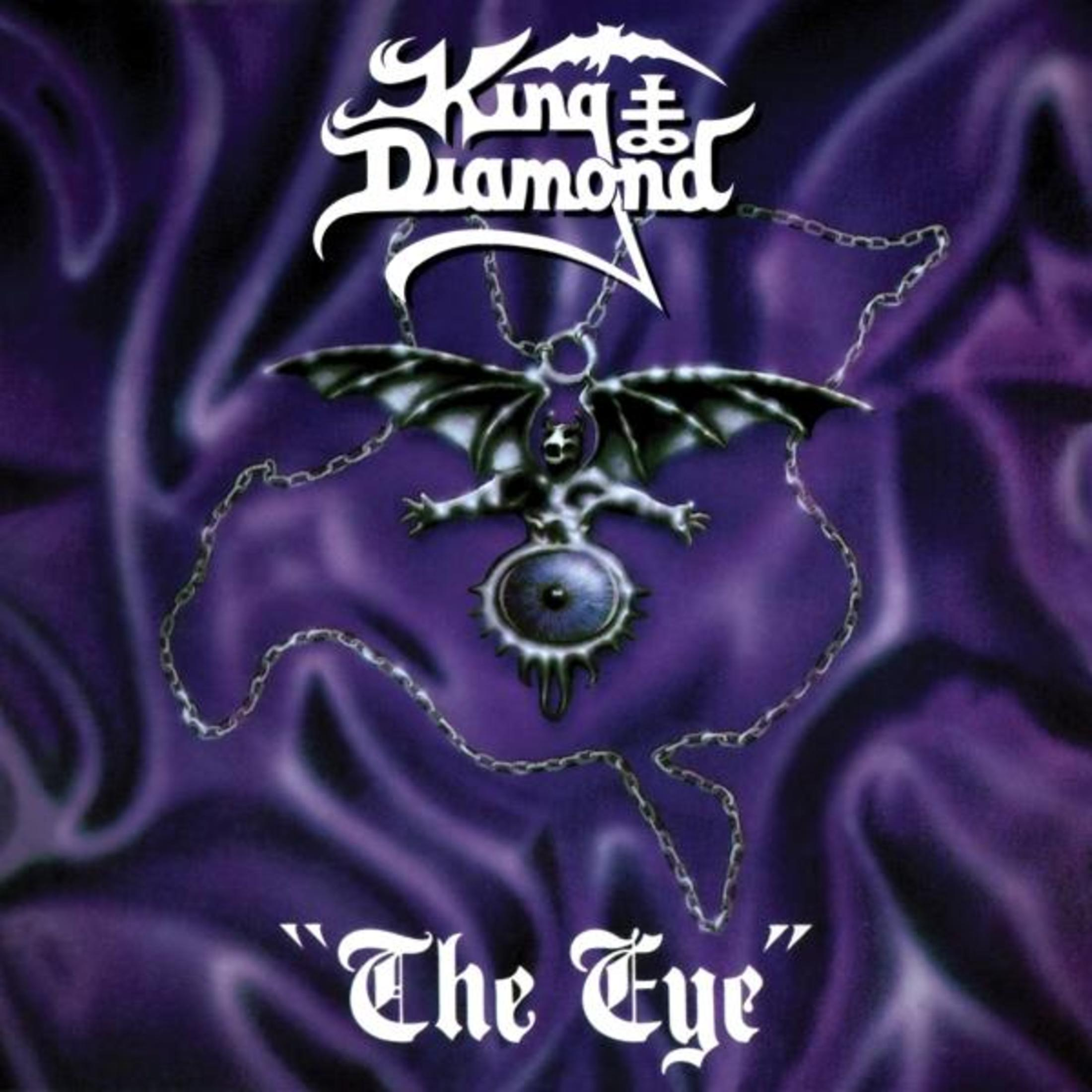 Copertina album King Diamond con figura demoniaca e catena su sfondo viola.