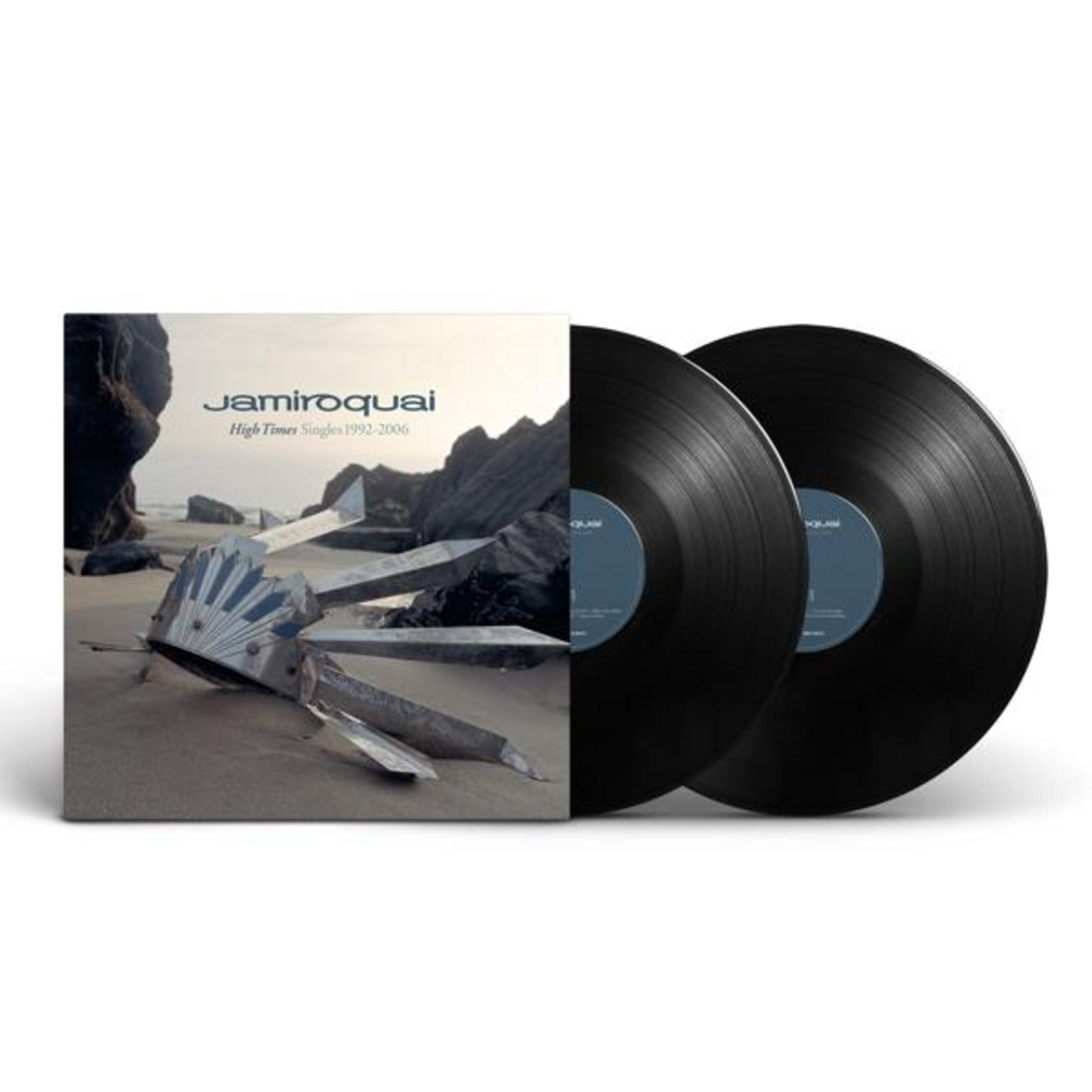 Copertina vinile Jamiroquai "High Times" con due dischi neri accanto.