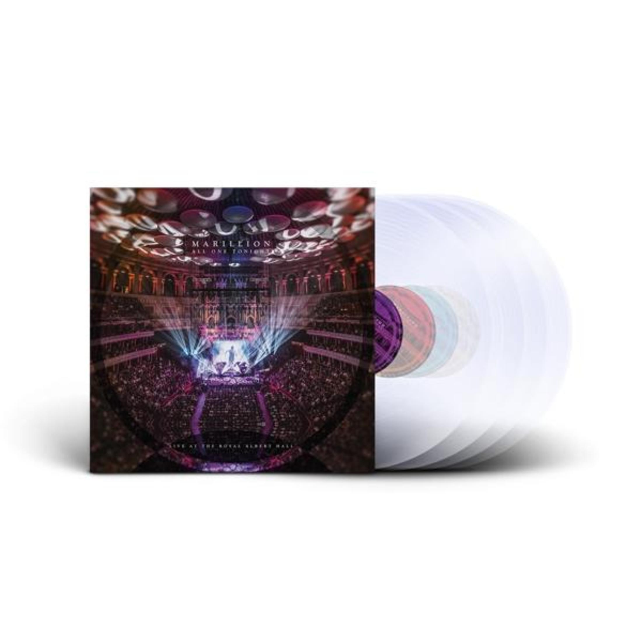 Un disco in vinile con immagine di concerto e diversi dischi in vinile colorati.