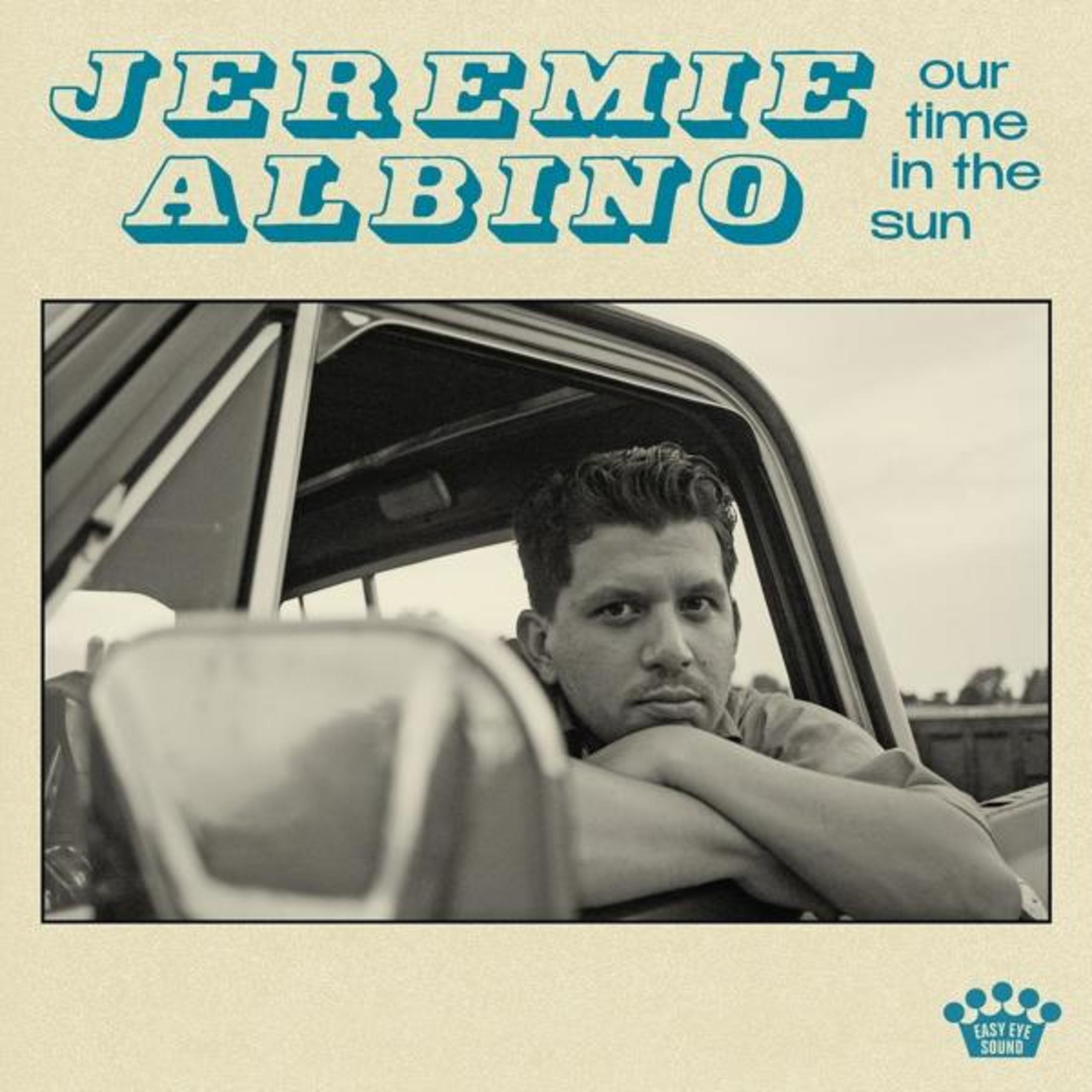 Uomo in auto con testo "JEREMIE ALBINO" e "our time in the sun".