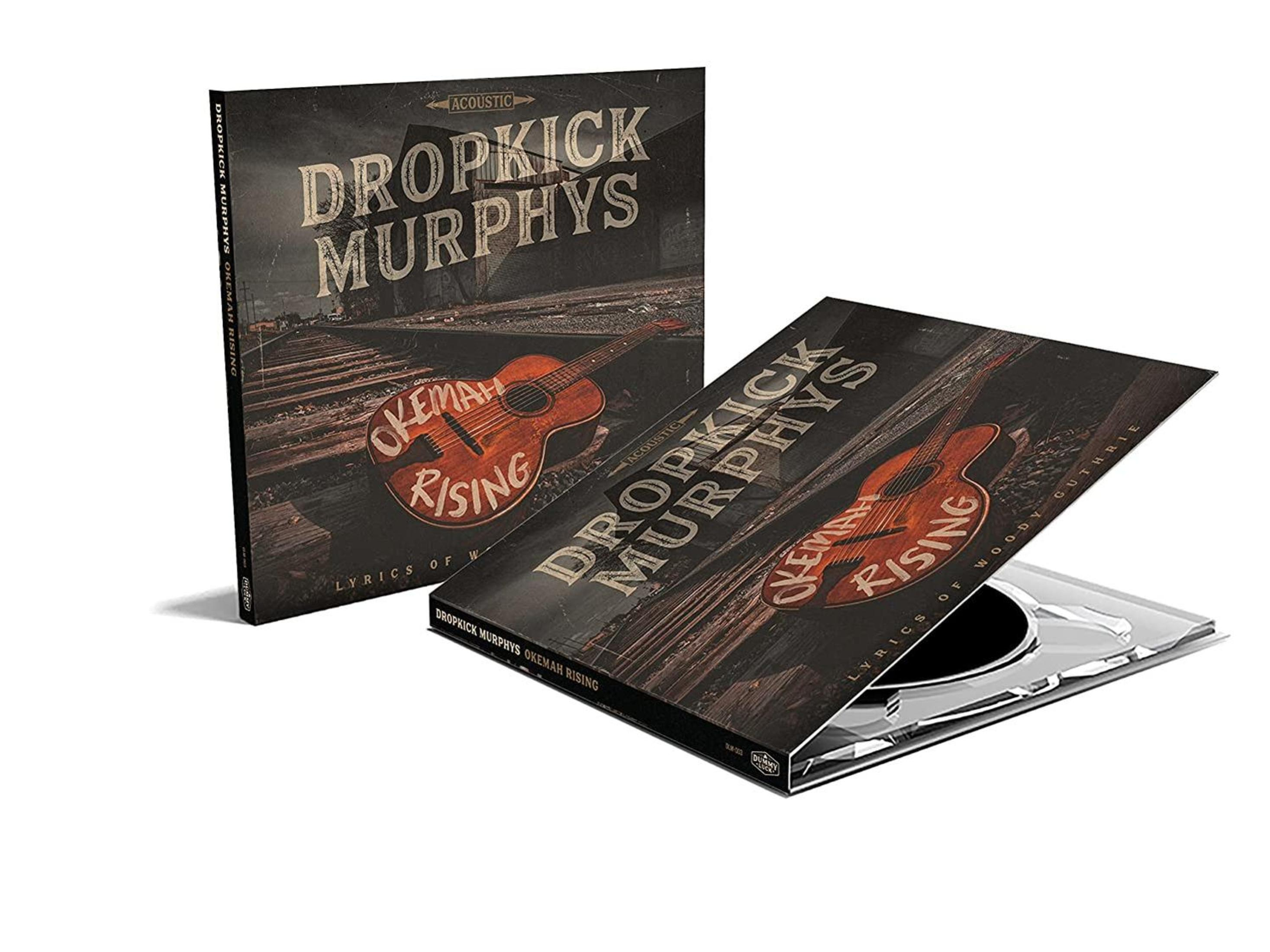 Copertina album Dropkick Murphys con chitarra e binari.