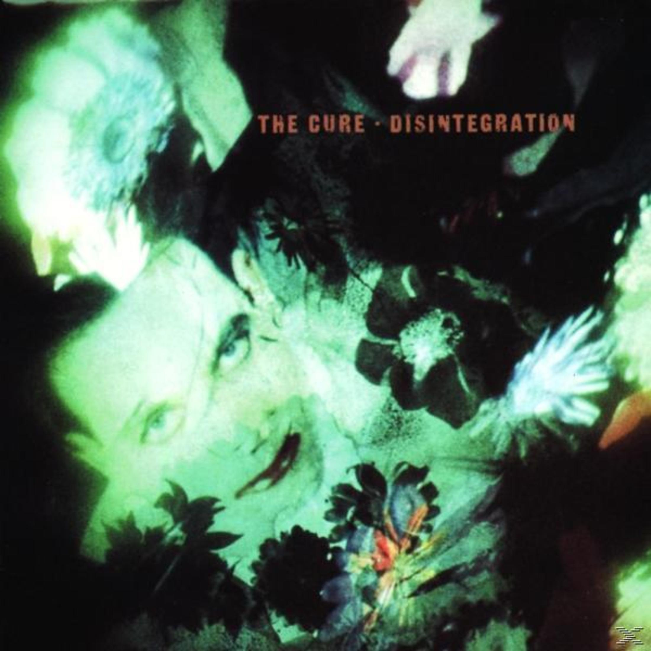Copertina album con viso verde, fiori e testo "The Cure Disintegration".