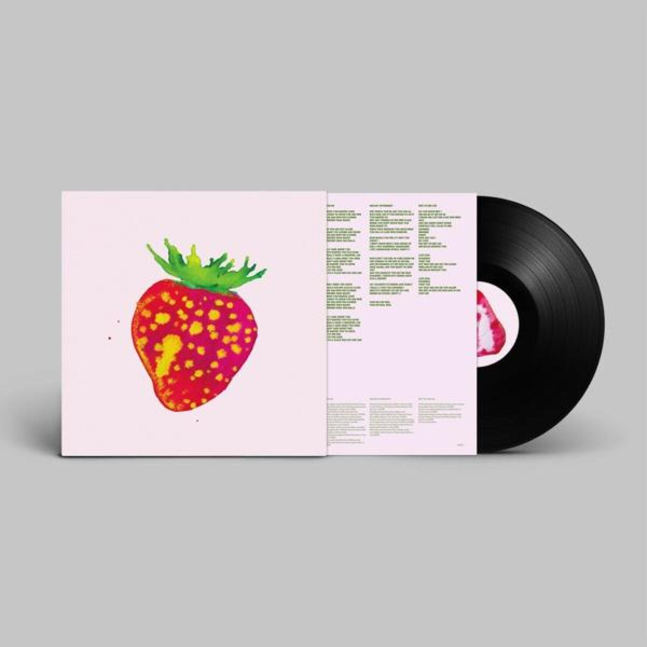 Un disco in vinile con copertina rosa raffigurante una fragola.