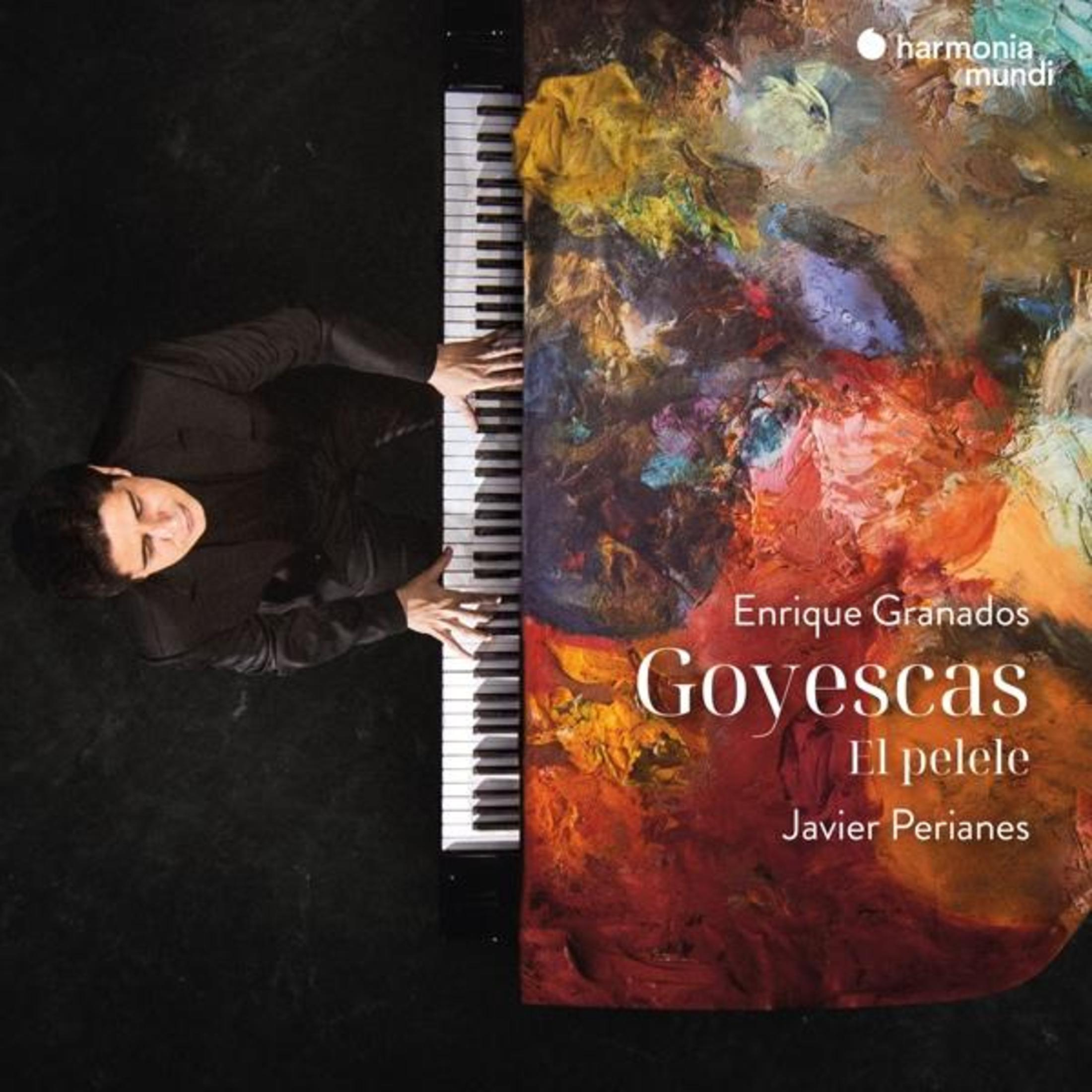 Un uomo in nero suona il pianoforte davanti a un dipinto colorato intitolato Goyescas.