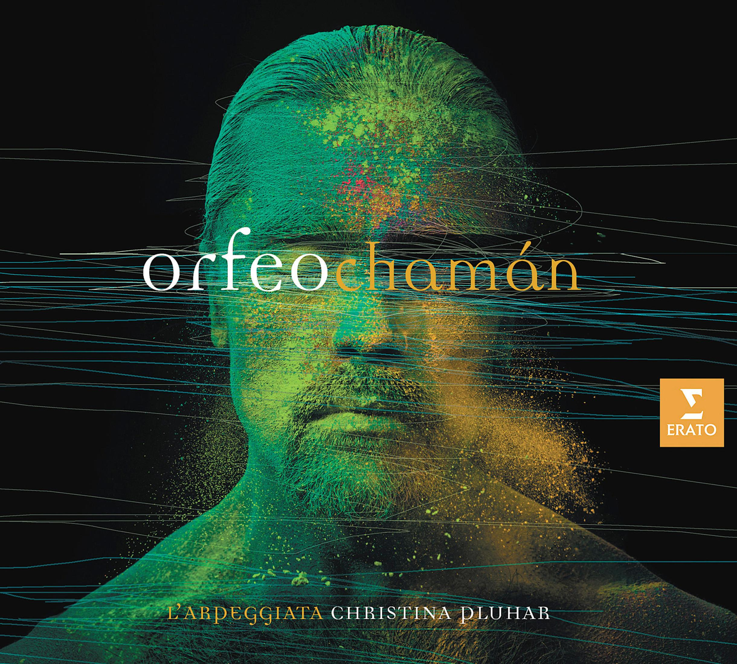 Man met groene en gele kleurendeeltjes op het gezicht, titel "Orfeo chamán".
