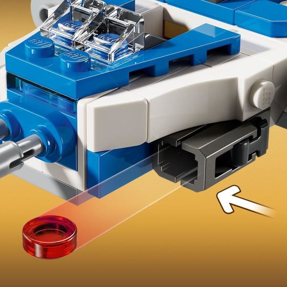 Kırmızı bir Lego tuğlası, mavi ve beyaz bir Lego yapısının yanına yerleştiriliyor.