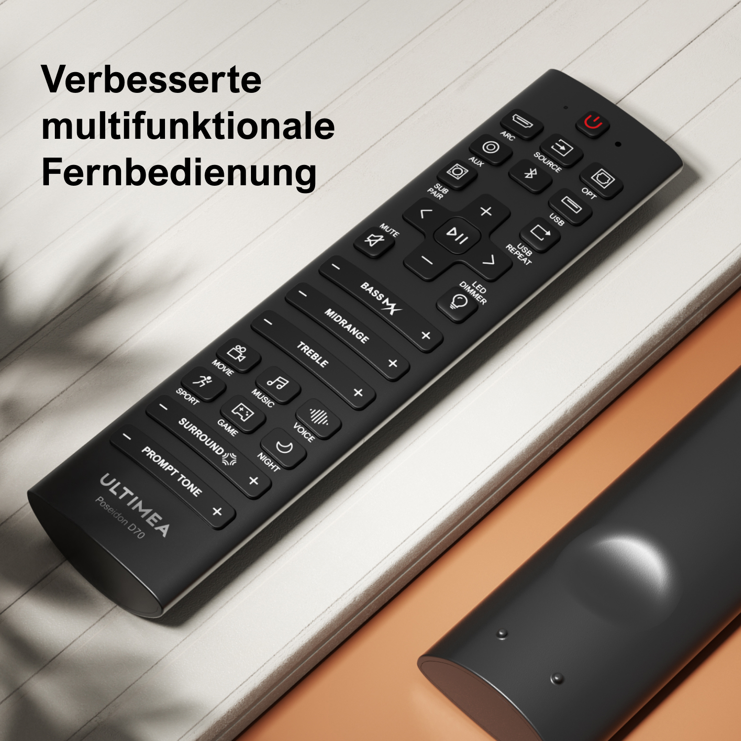 Télécommande noire avec de nombreux boutons, posée sur une surface en bois.