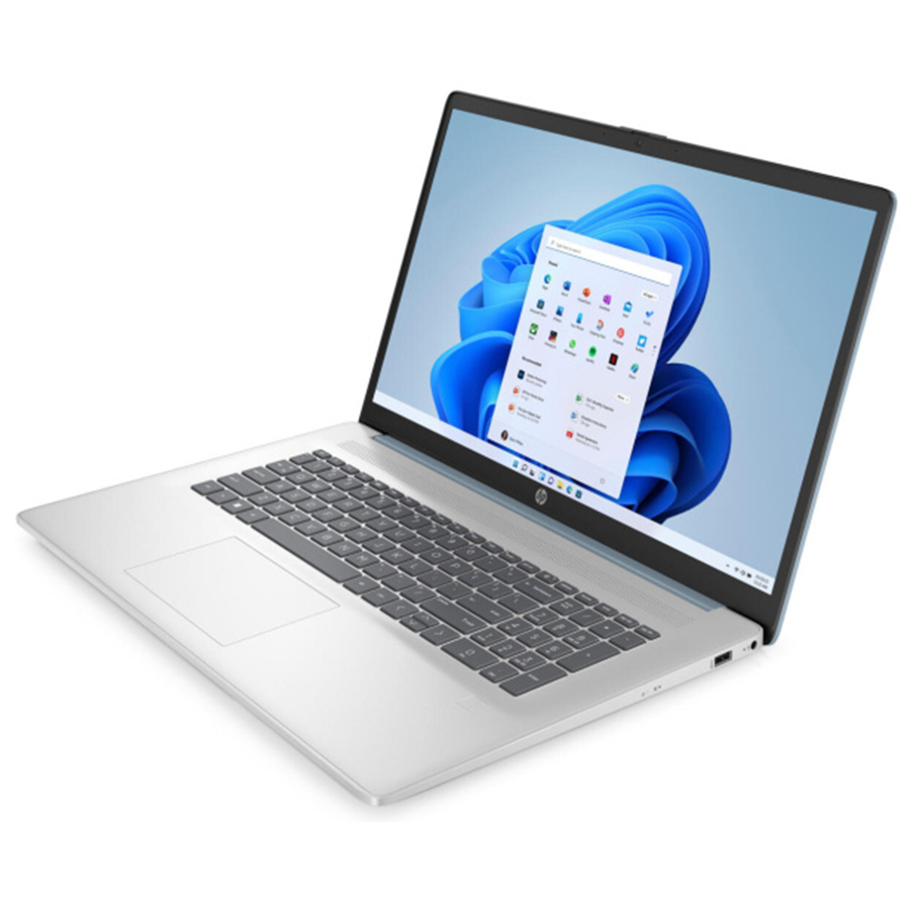 Srebrny laptop z otwartym ekranem, wyświetlający menu Start systemu Windows 11.