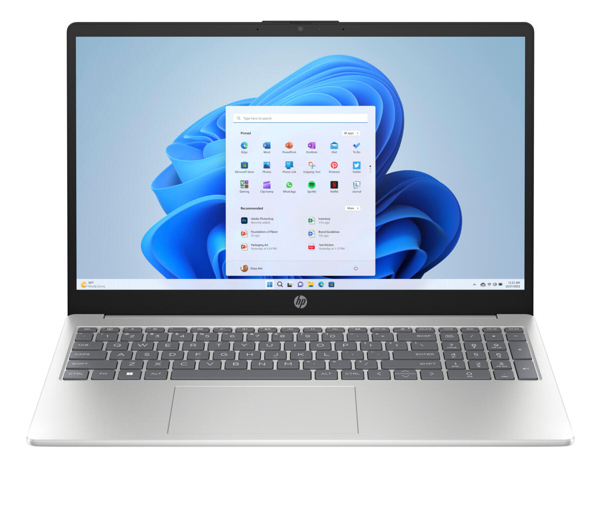 Otwarty laptop z systemem Windows 11 i niebieską tapetą.