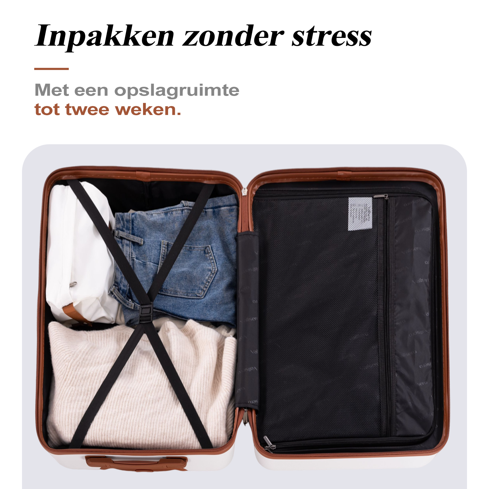 Open suitcase with clothes: sweater, jeans, and a white bag inside.