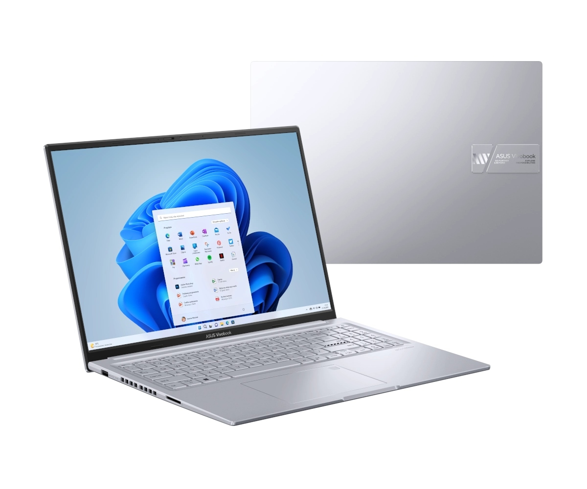 Srebrny laptop ASUS Vivobook z systemem Windows 11 i niebieską tapetą.