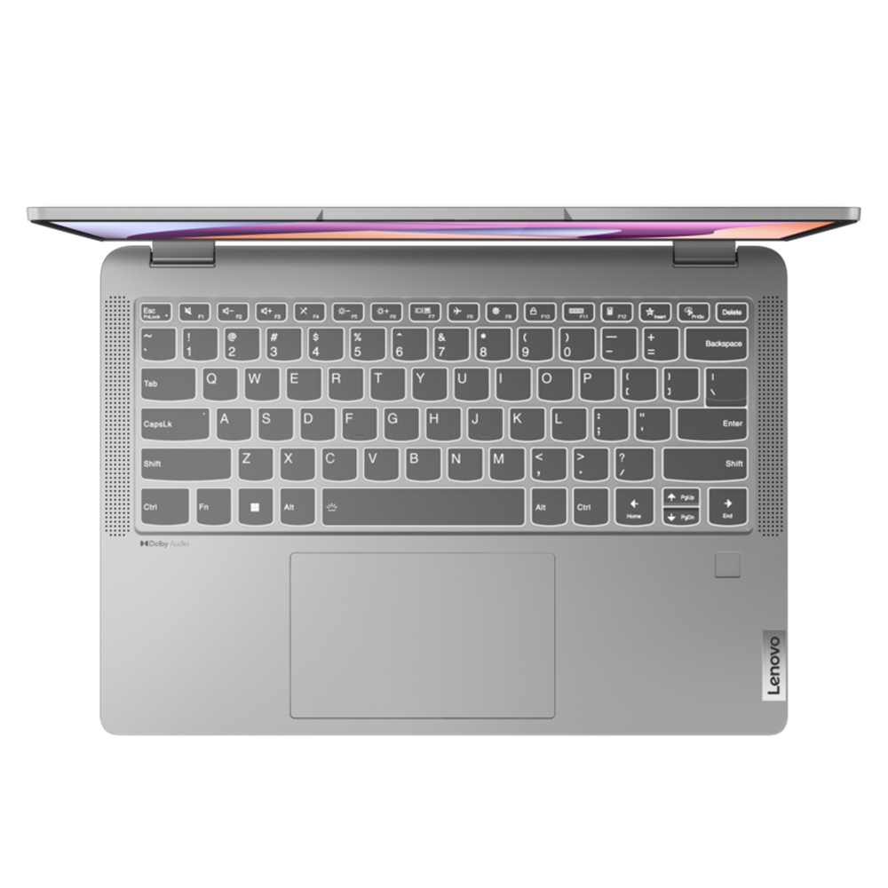Srebrny laptop, widok z góry, pokazujący klawiaturę i touchpad.