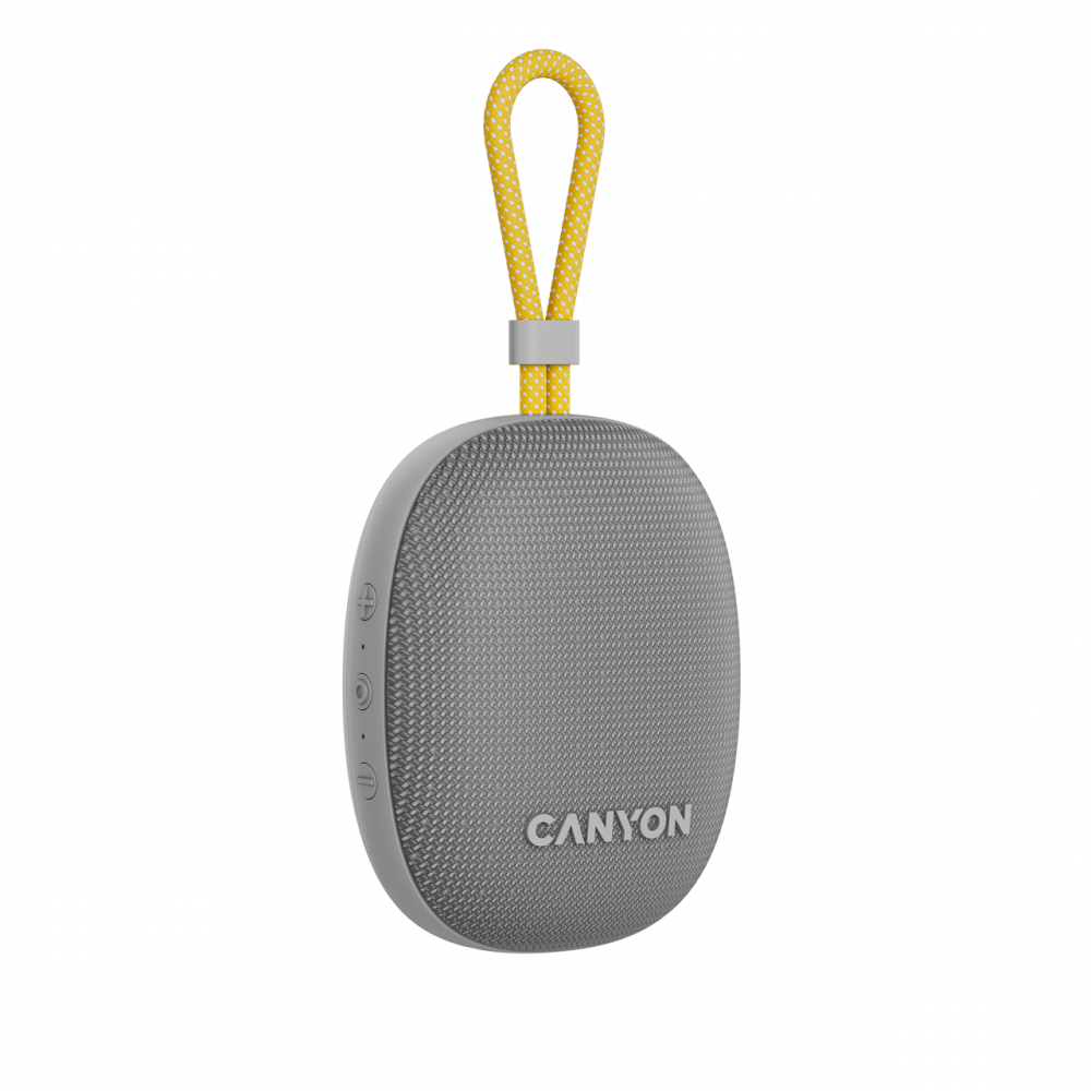 Szary głośnik Bluetooth Canyon z żółtą pętelką, czarne tło.