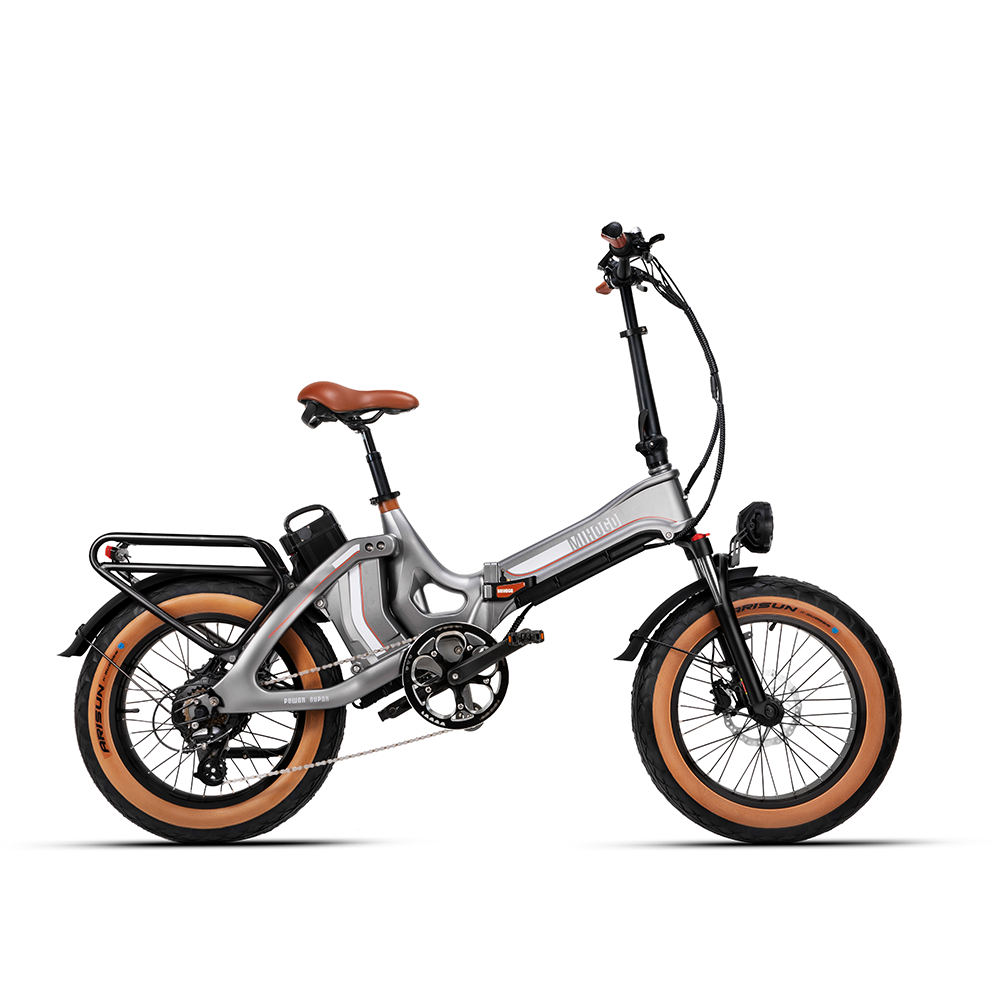 Ein graues faltbares E-Bike mit braunem Sattel und breiten Reifen.