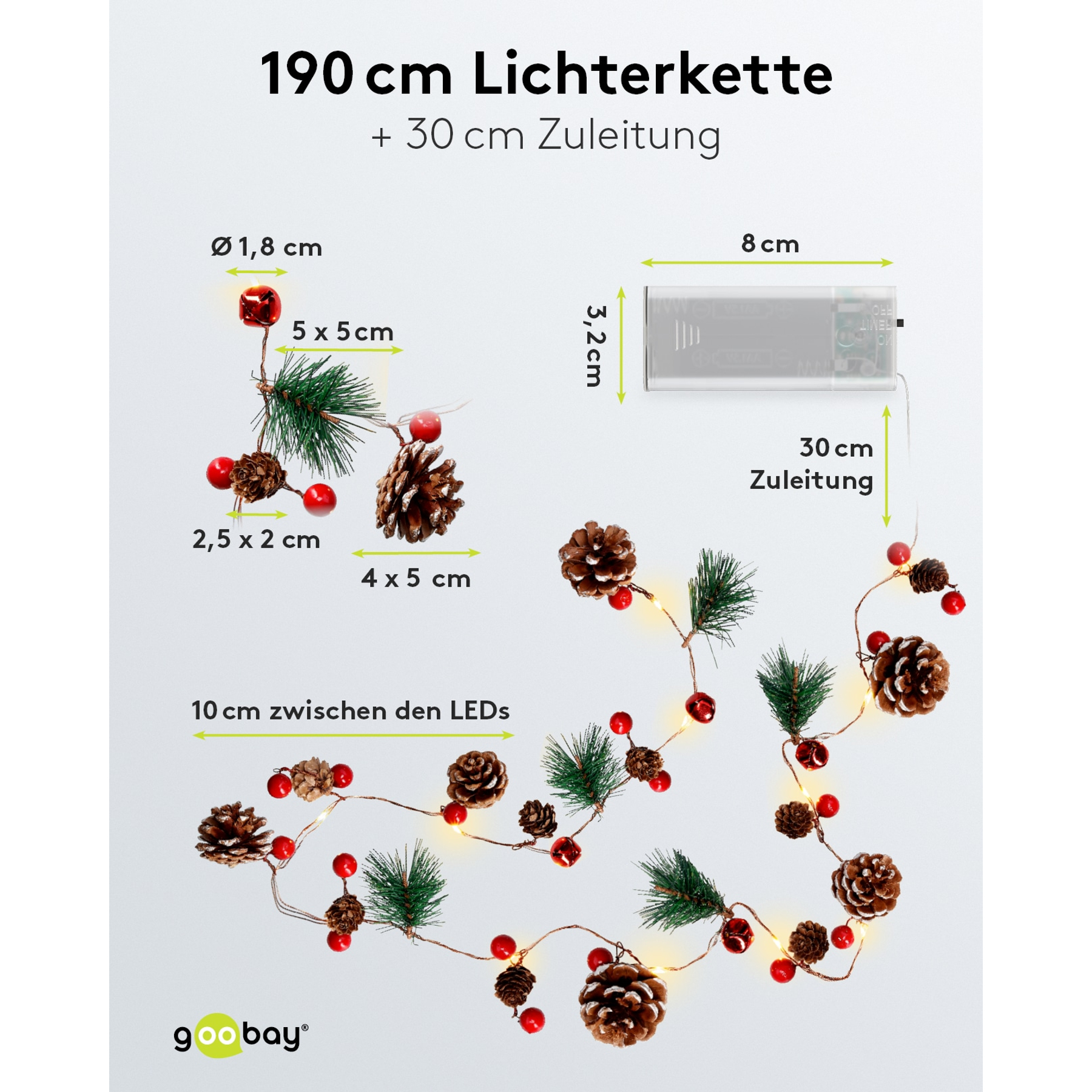 Eine Lichterkette mit Zapfen, Beeren und Tannenzweigen, beleuchtet.