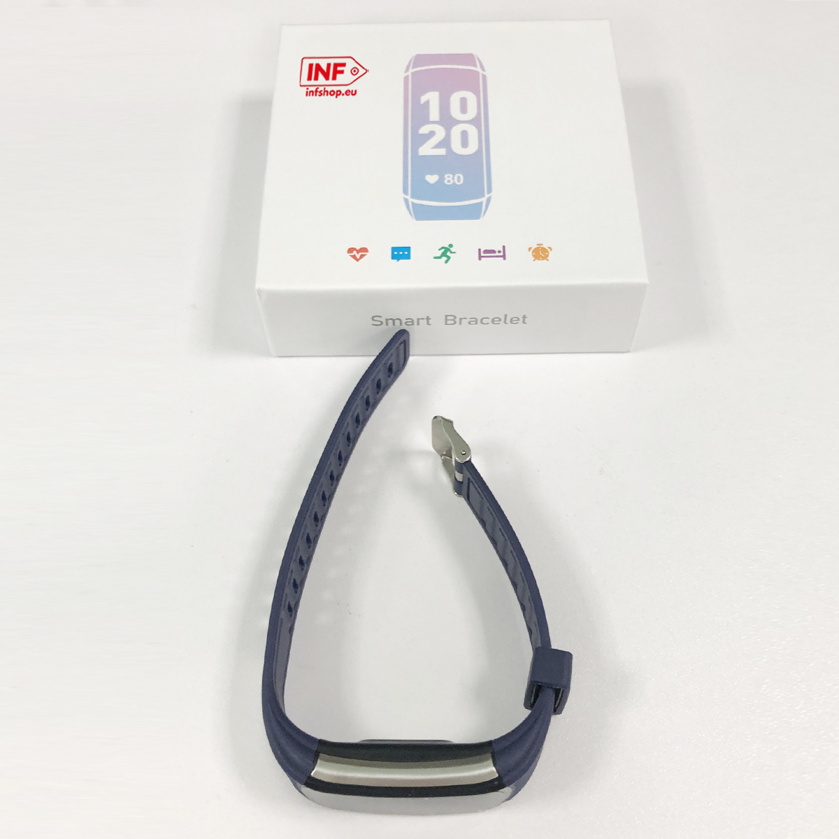 Niebieska opaska smart leży obok białego pudełka z ikonami.