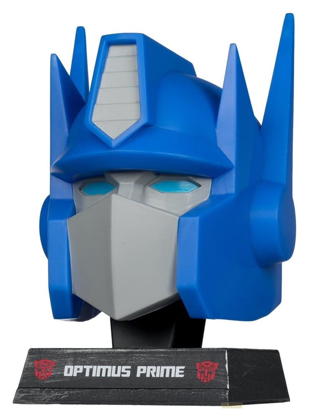 Statua testa di Optimus Prime, plastica blu e grigia, con base.
