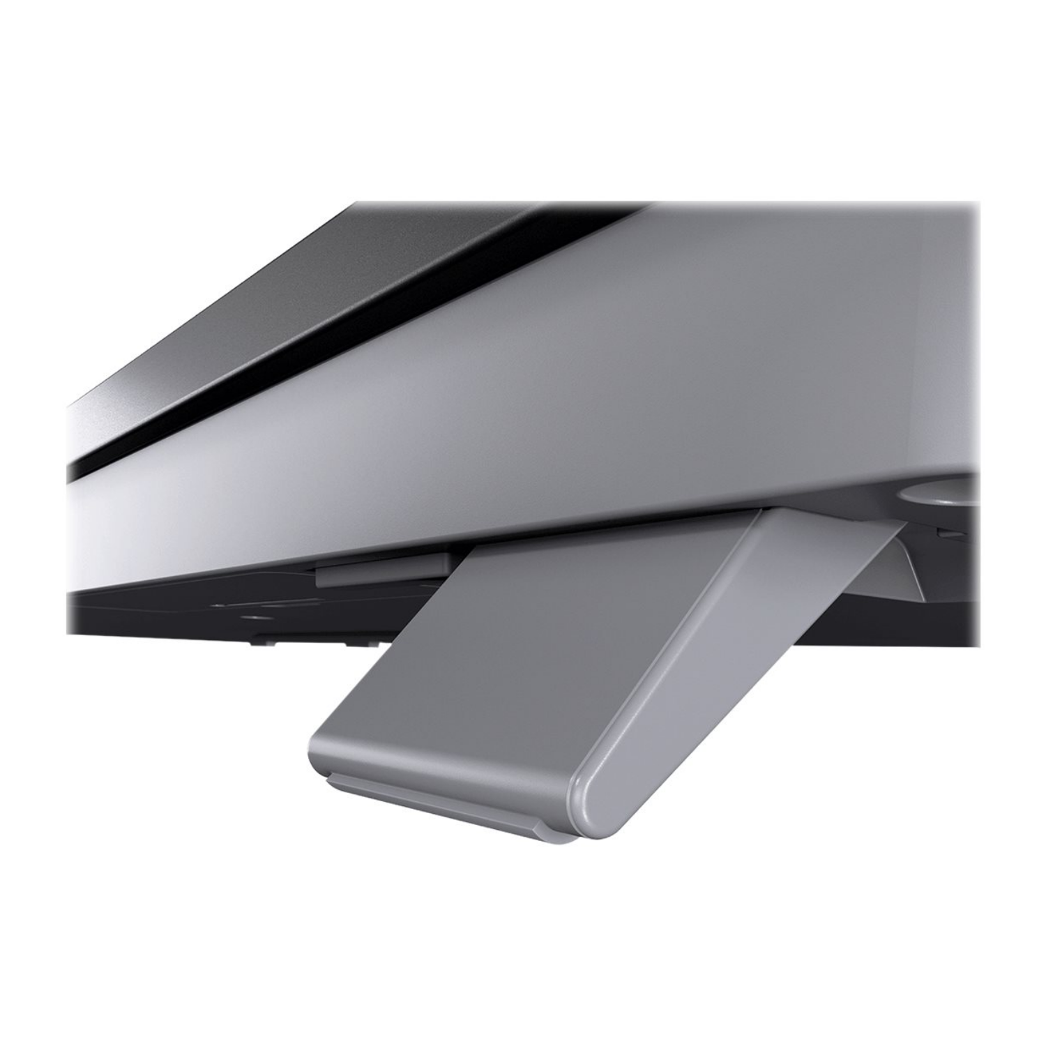 Szary rozkładany stojak jest przymocowany do ciemnego urządzenia.