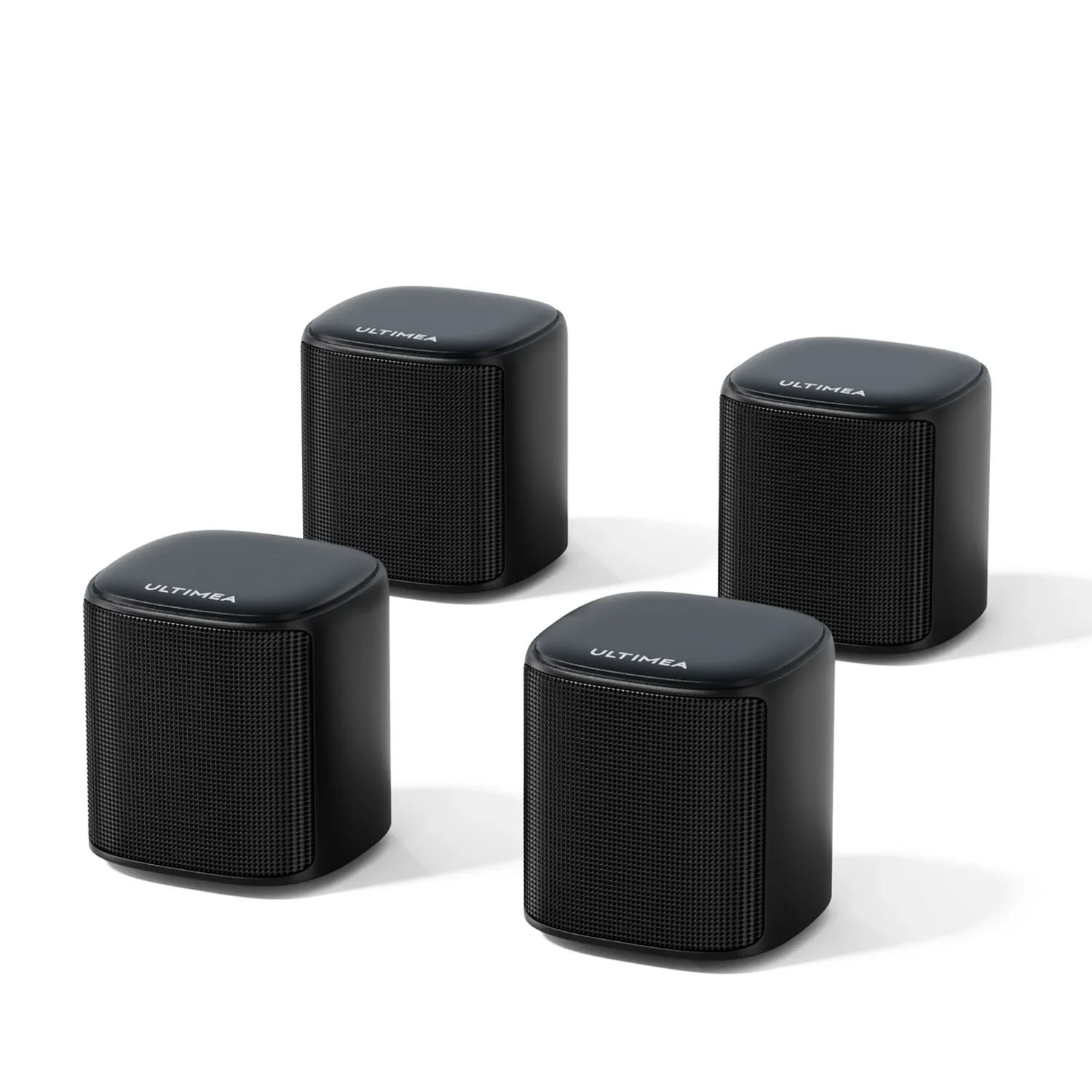 Quatre enceintes noires Ultima sont disposées en carré sur fond blanc.