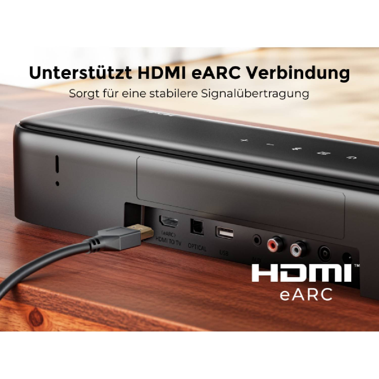 Un câble HDMI est branché sur le port eARC d'une barre de son.