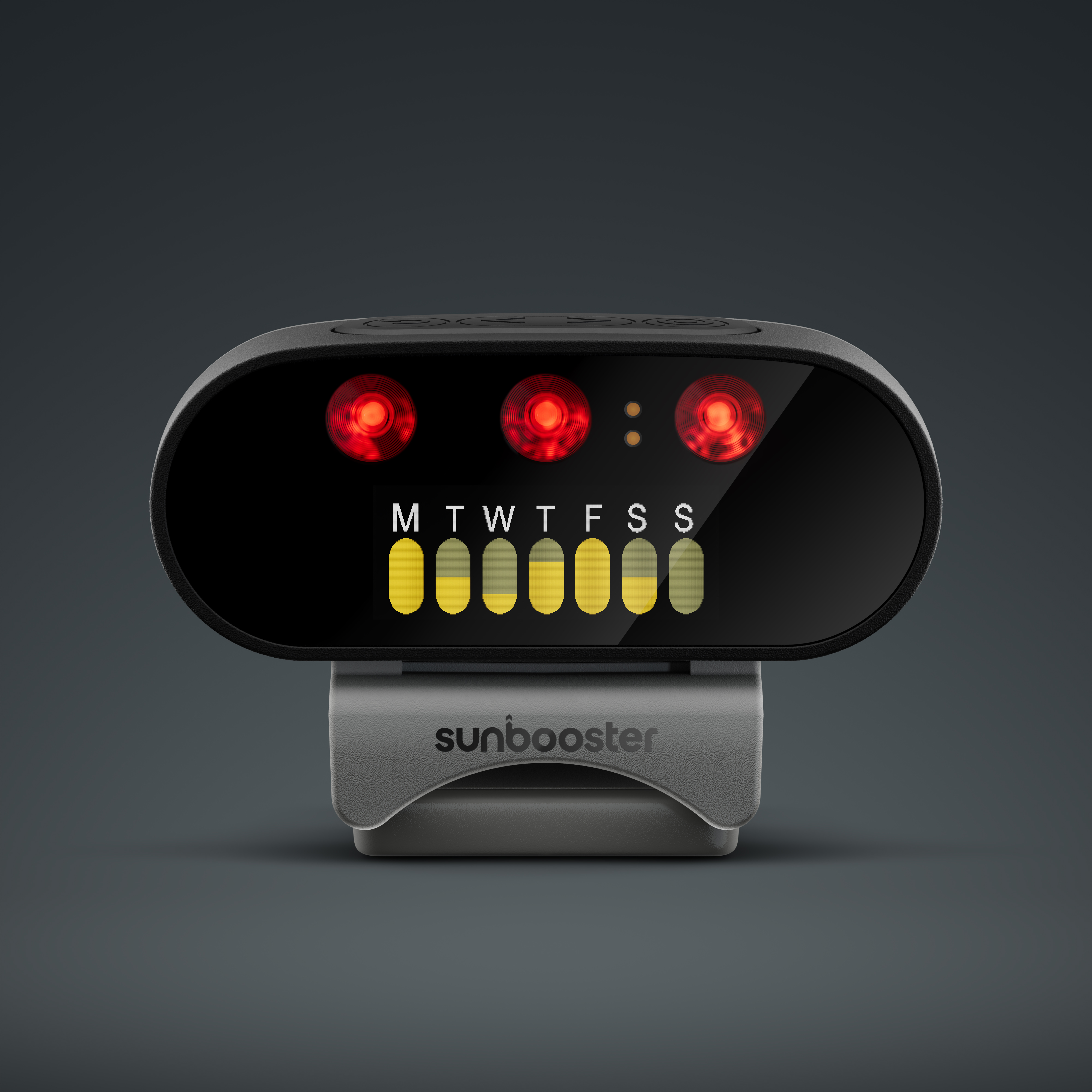 A black device with red lights and yellow bars on a gray stand.