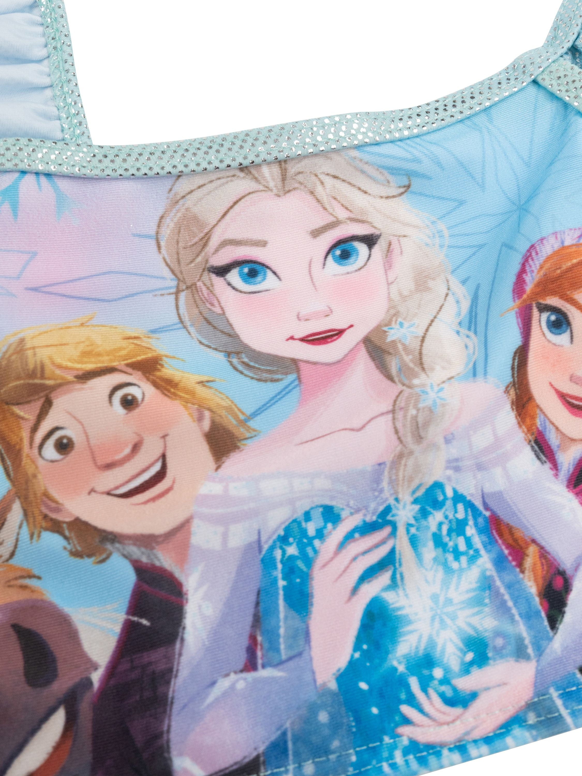 Elsa und Anna von Frozen mit Kristoff und Sven auf blauem Stoff.