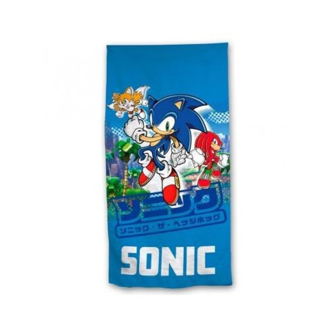 Sonic, Tails und Knuckles auf blauem Hintergrund mit japanischen Schriftzeichen.