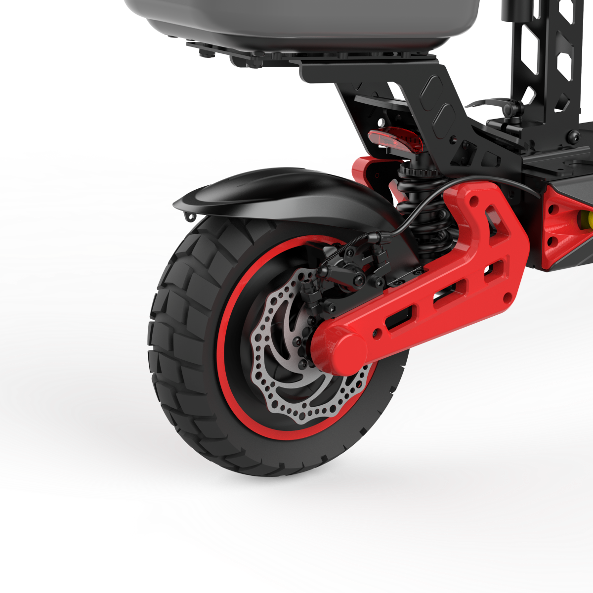 Zbliżenie tylnego koła hulajnogi elektrycznej, czerwonej ramy i hamulca tarczowego.