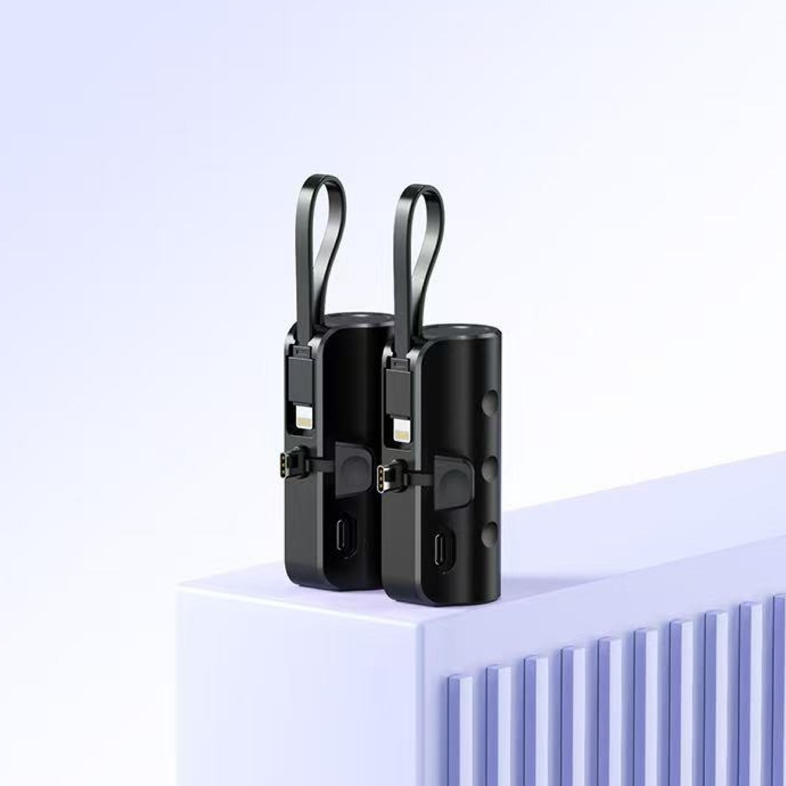 Askılı ve USB portlu iki siyah silindirik cihaz.