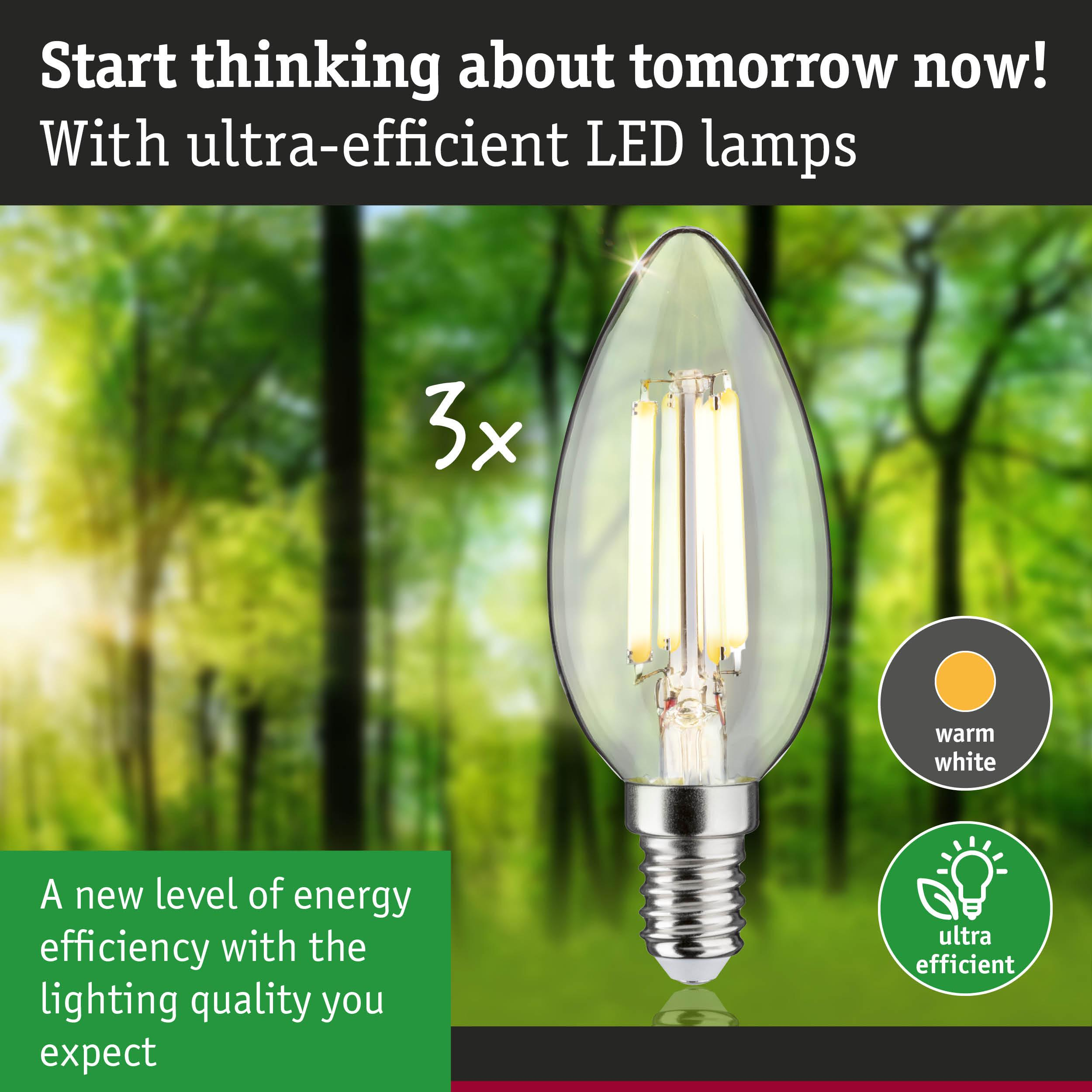 Żarówka LED w kolorze ciepłej bieli przed zielonym lasem. Widoczne napisy "3x" i "ultra wydajna".