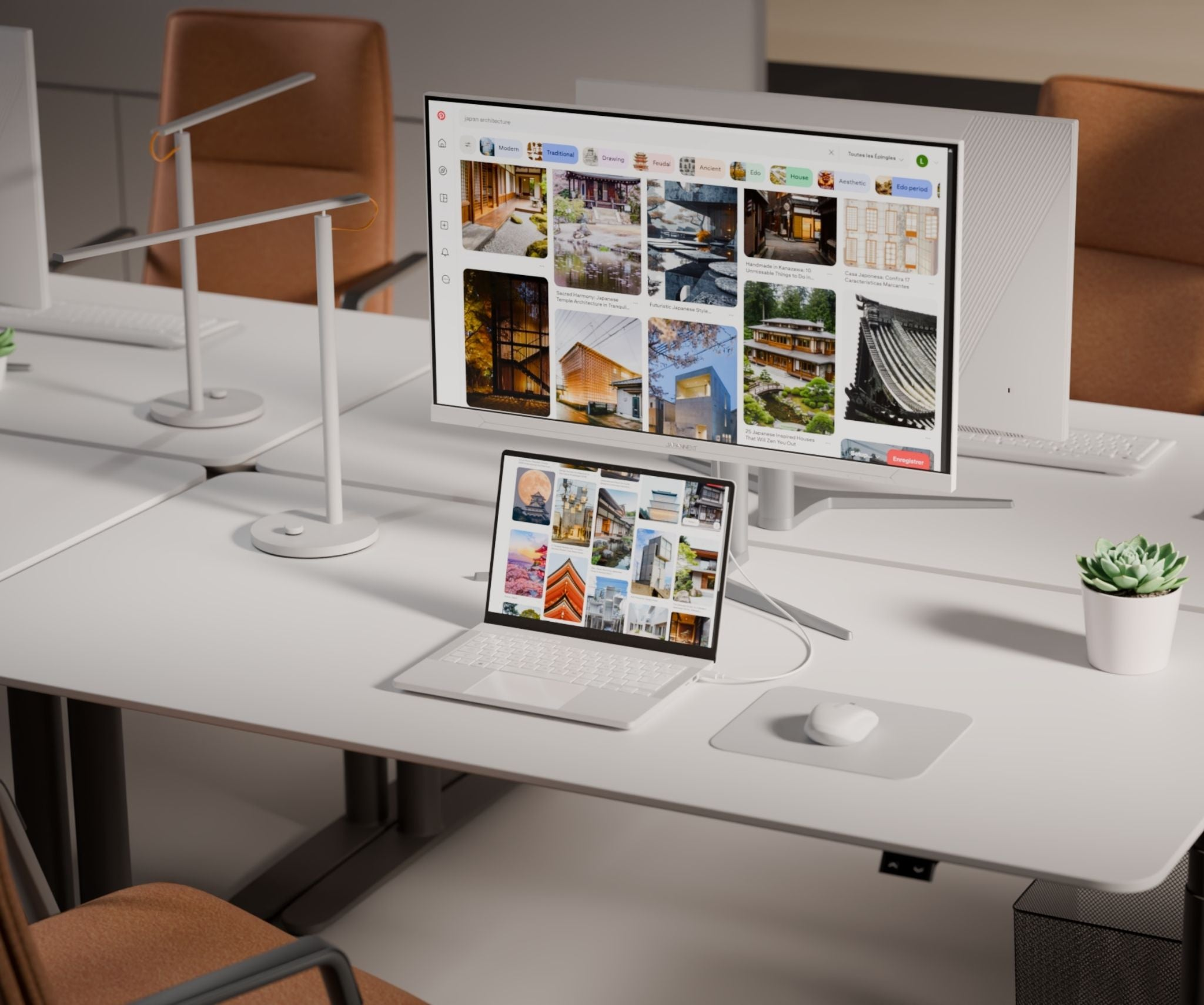 Ein Schreibtisch mit zwei Monitoren, die japanische Architektur zeigen, und einem Laptop.