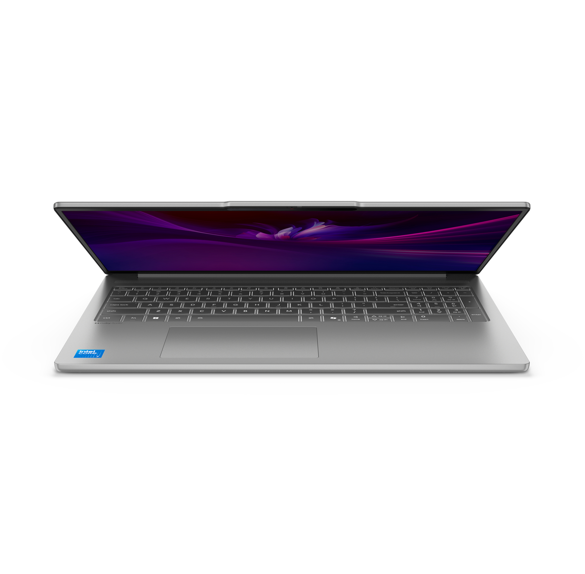 Un laptop argentato aperto con tastiera e sfondo viola.