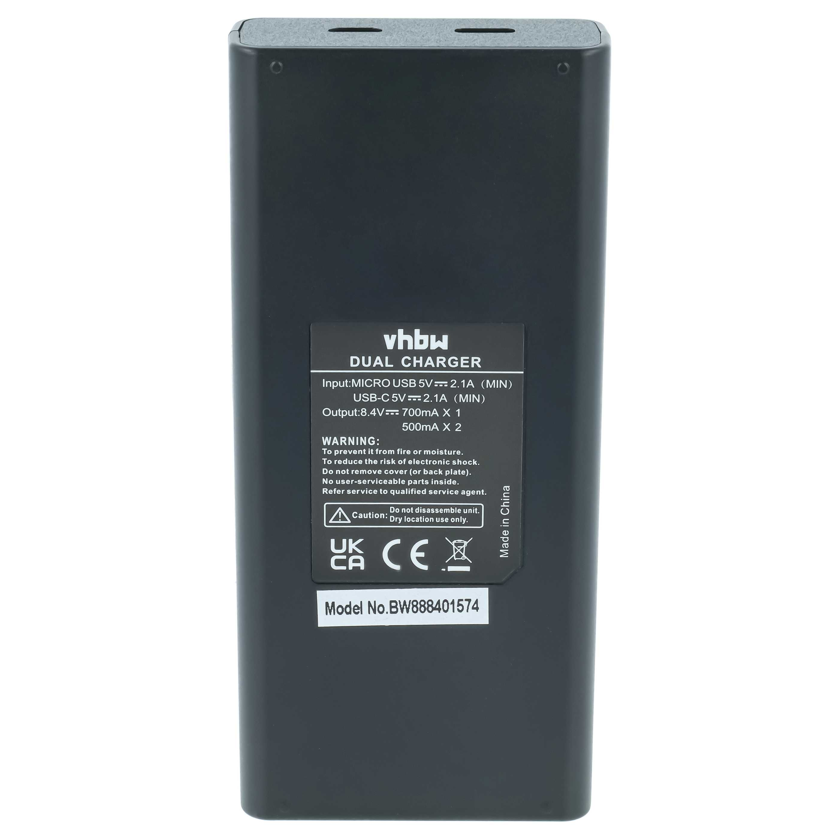Schwarzes Dual-Ladegerät mit Beschriftung: VHBW DUAL CHARGER, Warnhinweise und Modellnummer.