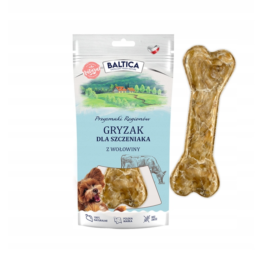 Kostka wołowa dla szczeniaka obok opakowania.