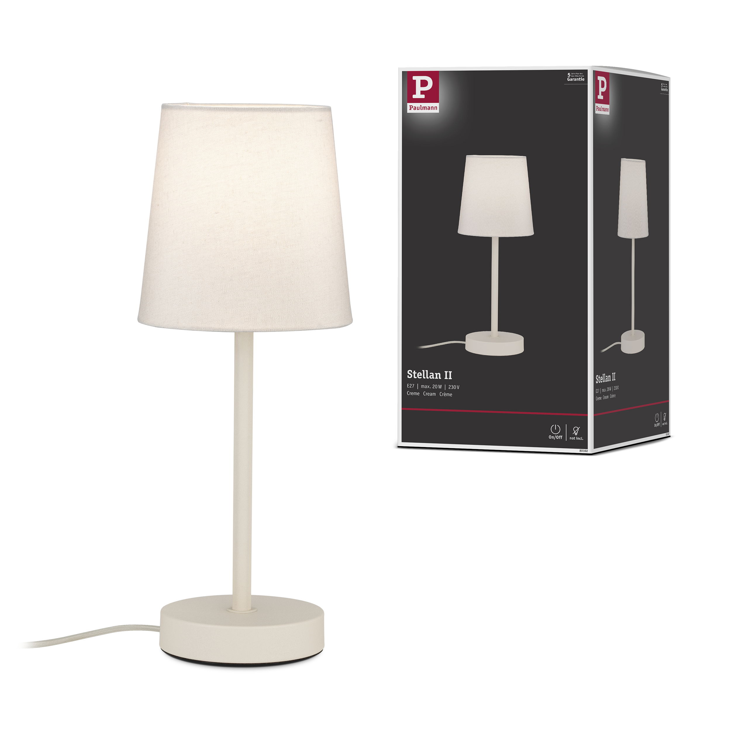 Kremowa lampa stołowa z materiałowym abażurem stoi obok opakowania.