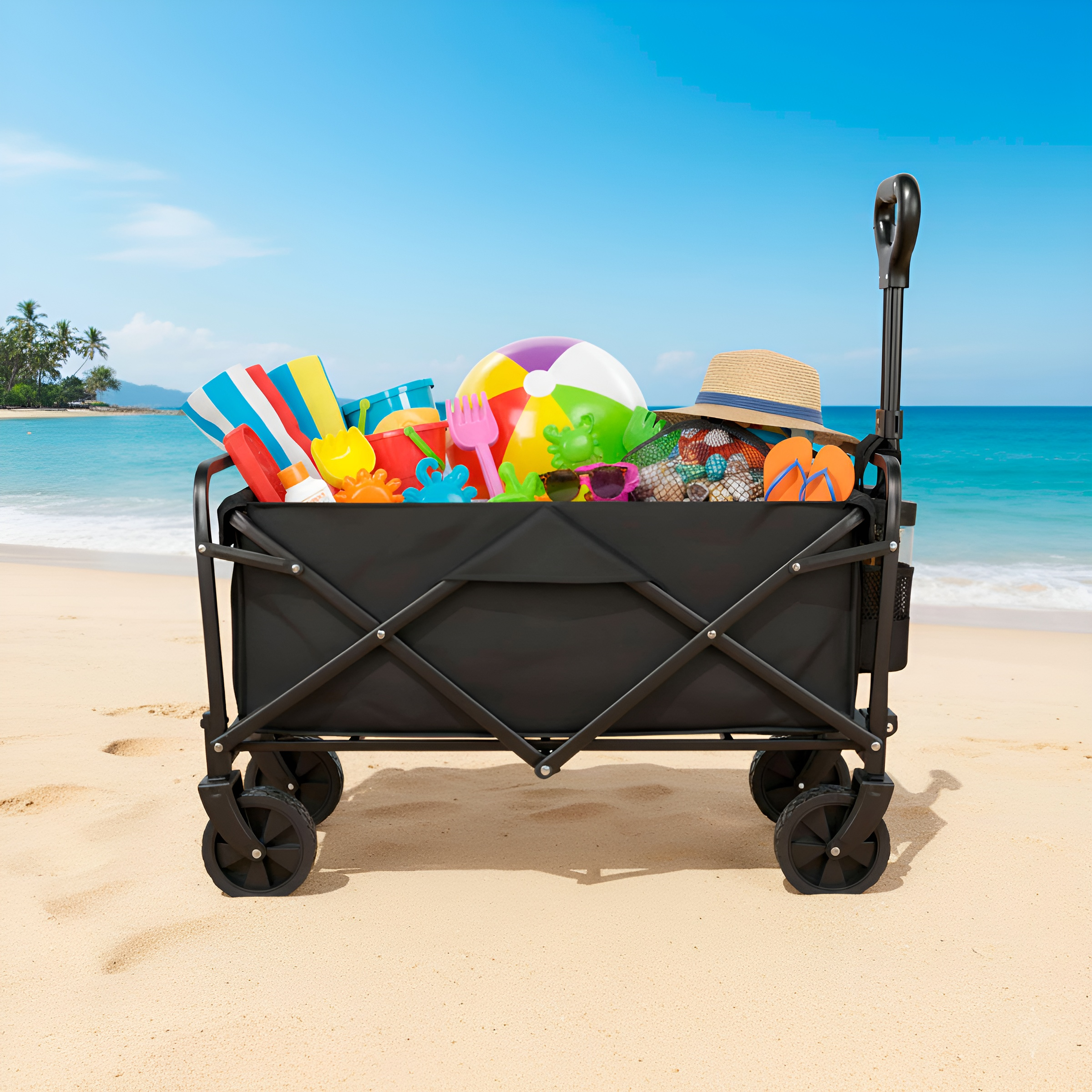 Un carrito de playa negro lleno de juguetes, pelotas y un sombrero.