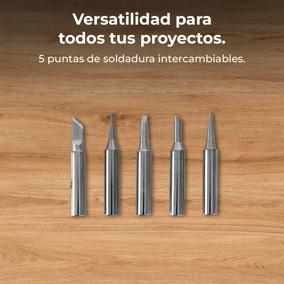 Cinque punte di saldatura argentate con punte diverse su superficie di legno.