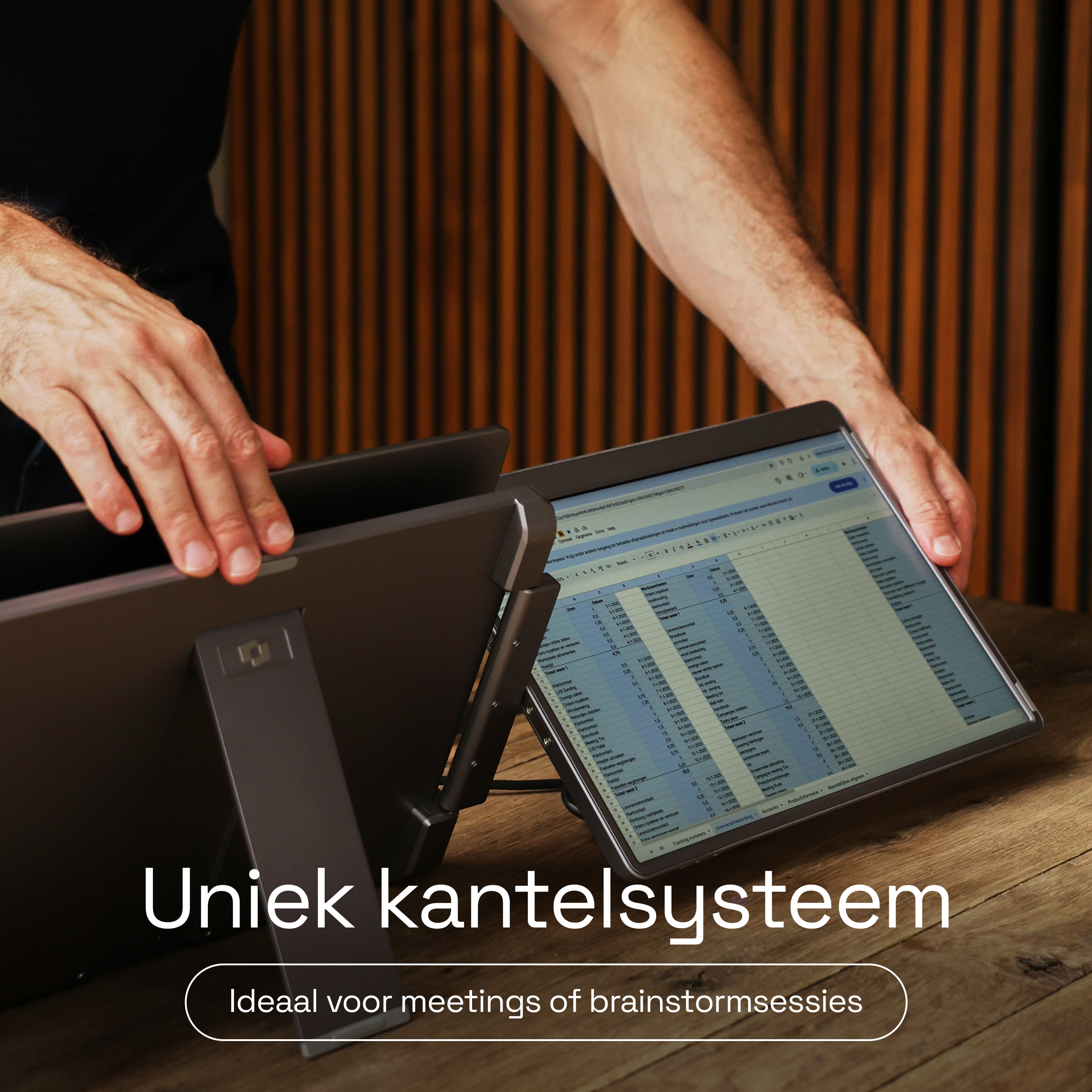 A man presents an adjustable tablet stand, ideal for meetings or brainstorming.