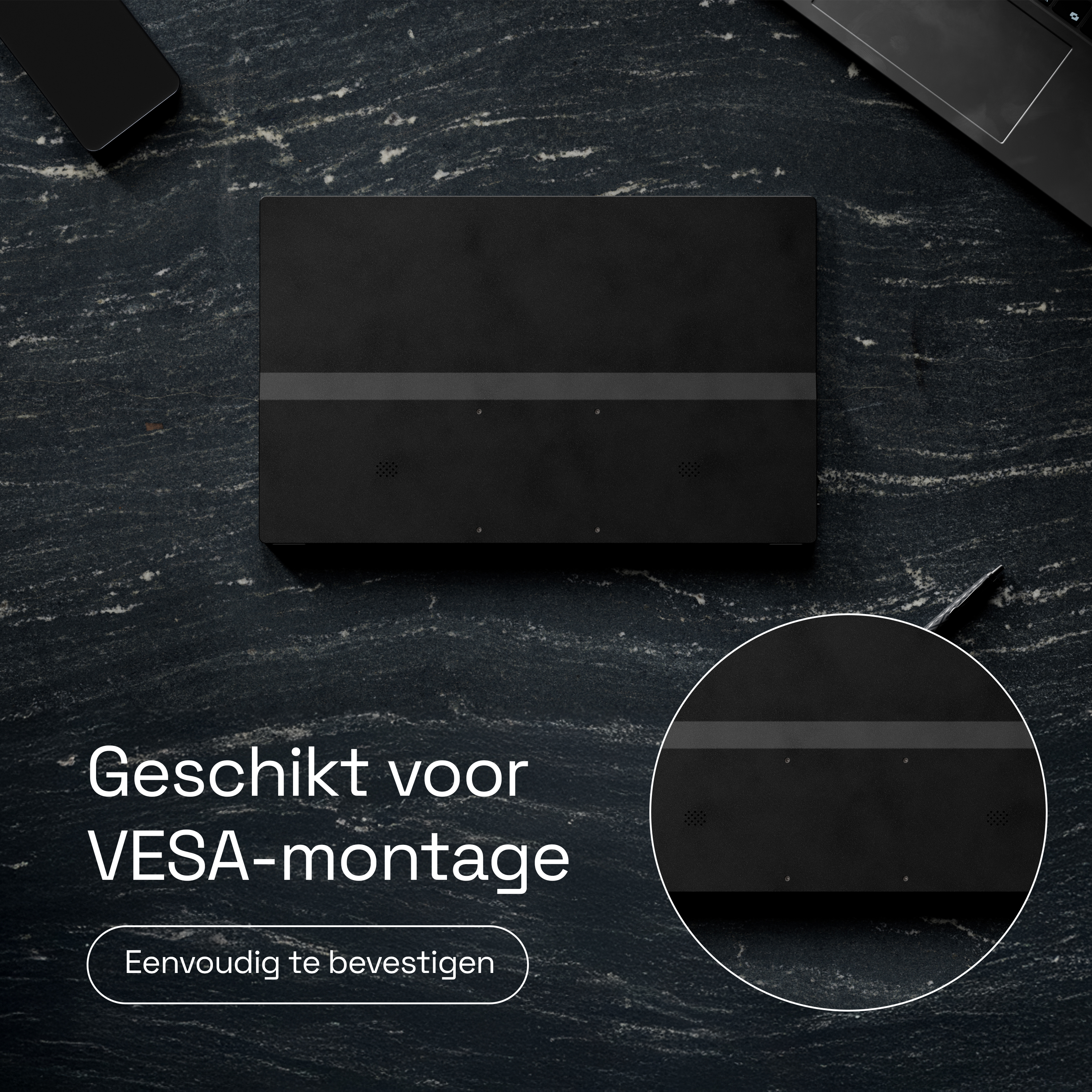 Black device with VESA mount on dark stone surface.