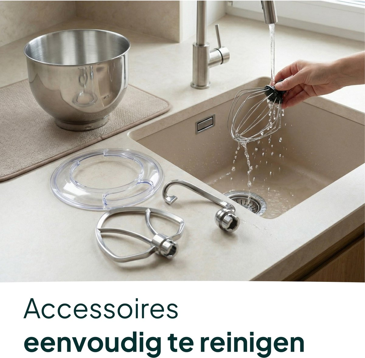 Kitchen mixer accessories on a countertop next to a sink.