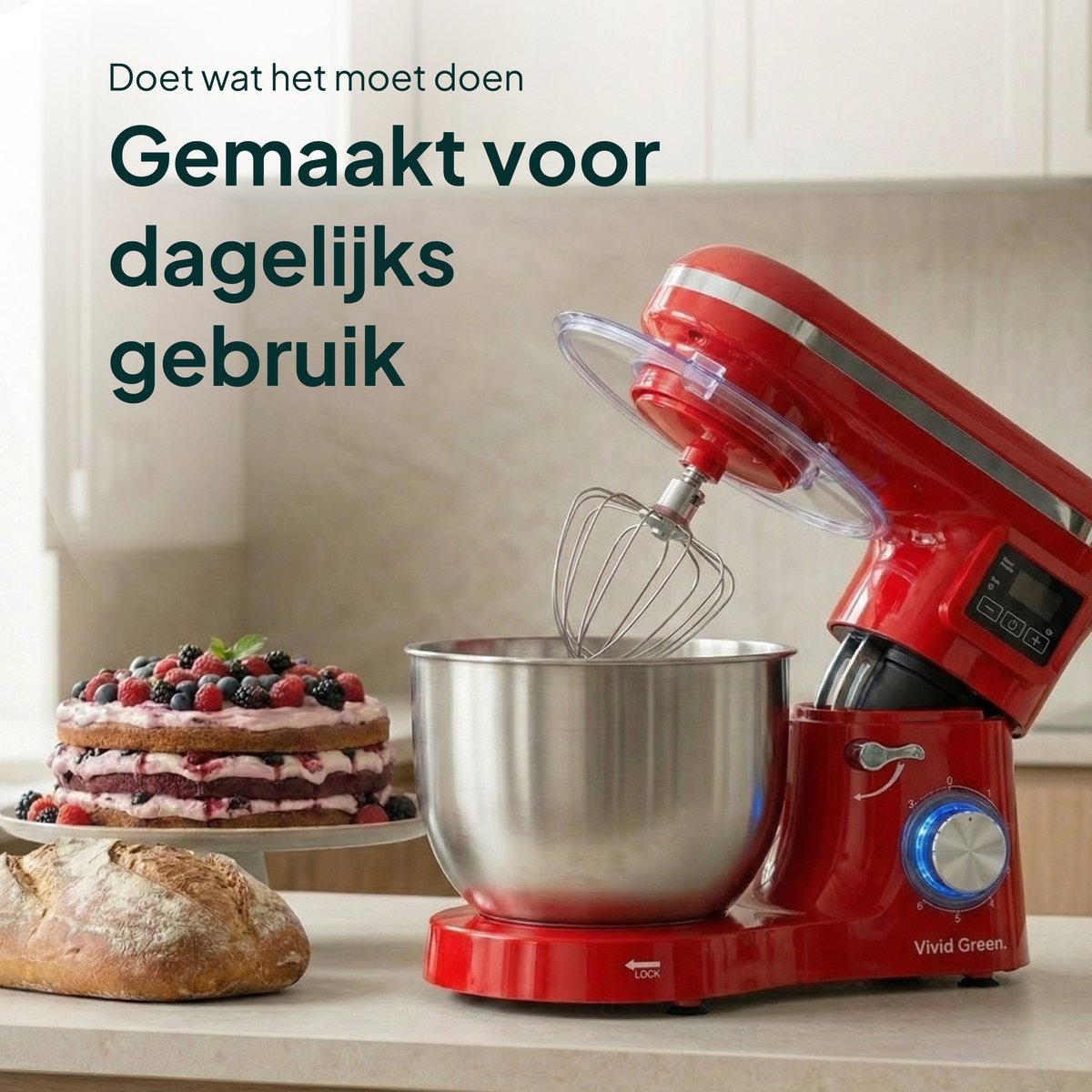 A red stand mixer sits beside a cake and bread.