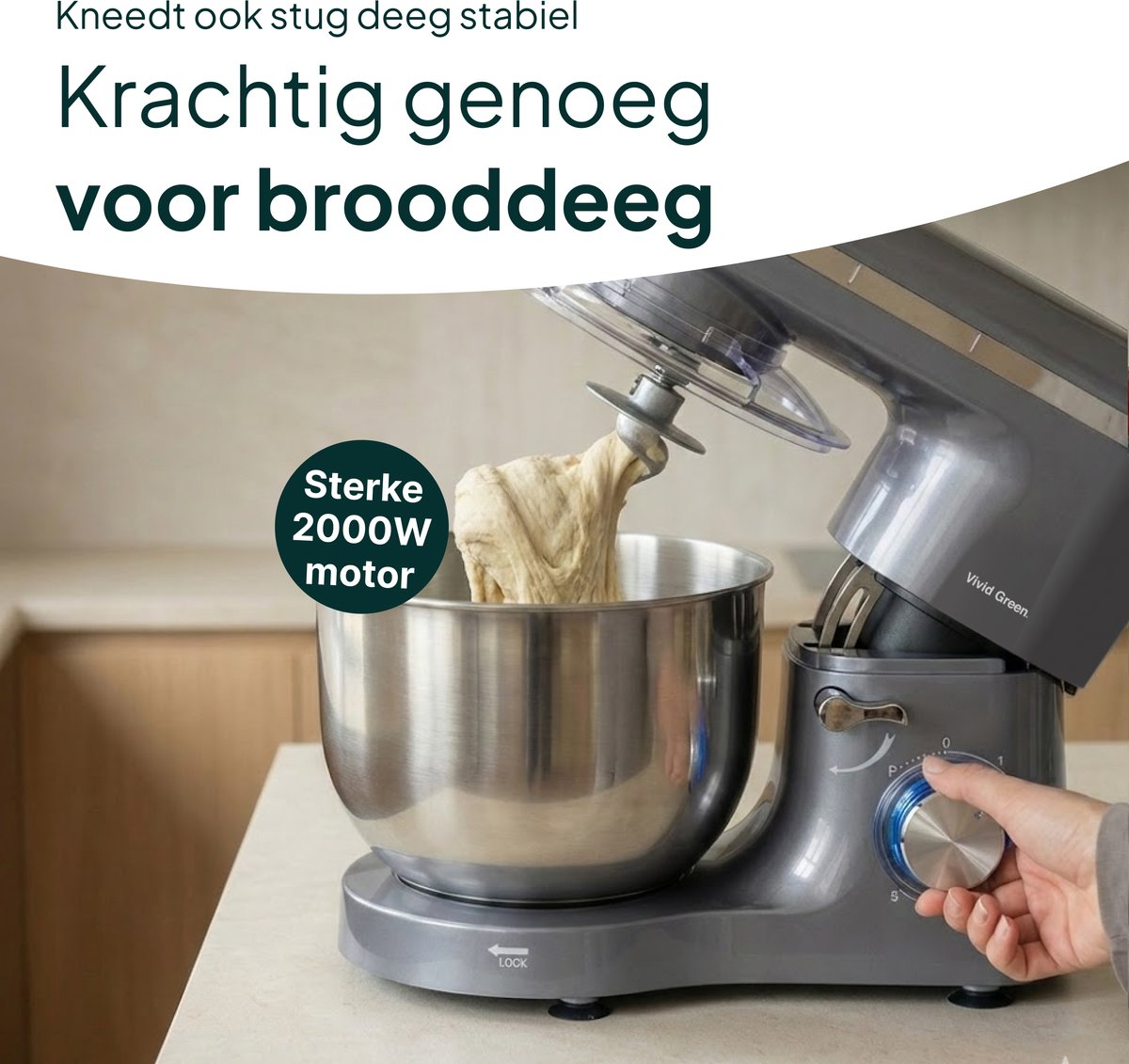 Gray kitchen mixer with dough in stainless steel bowl and hook.