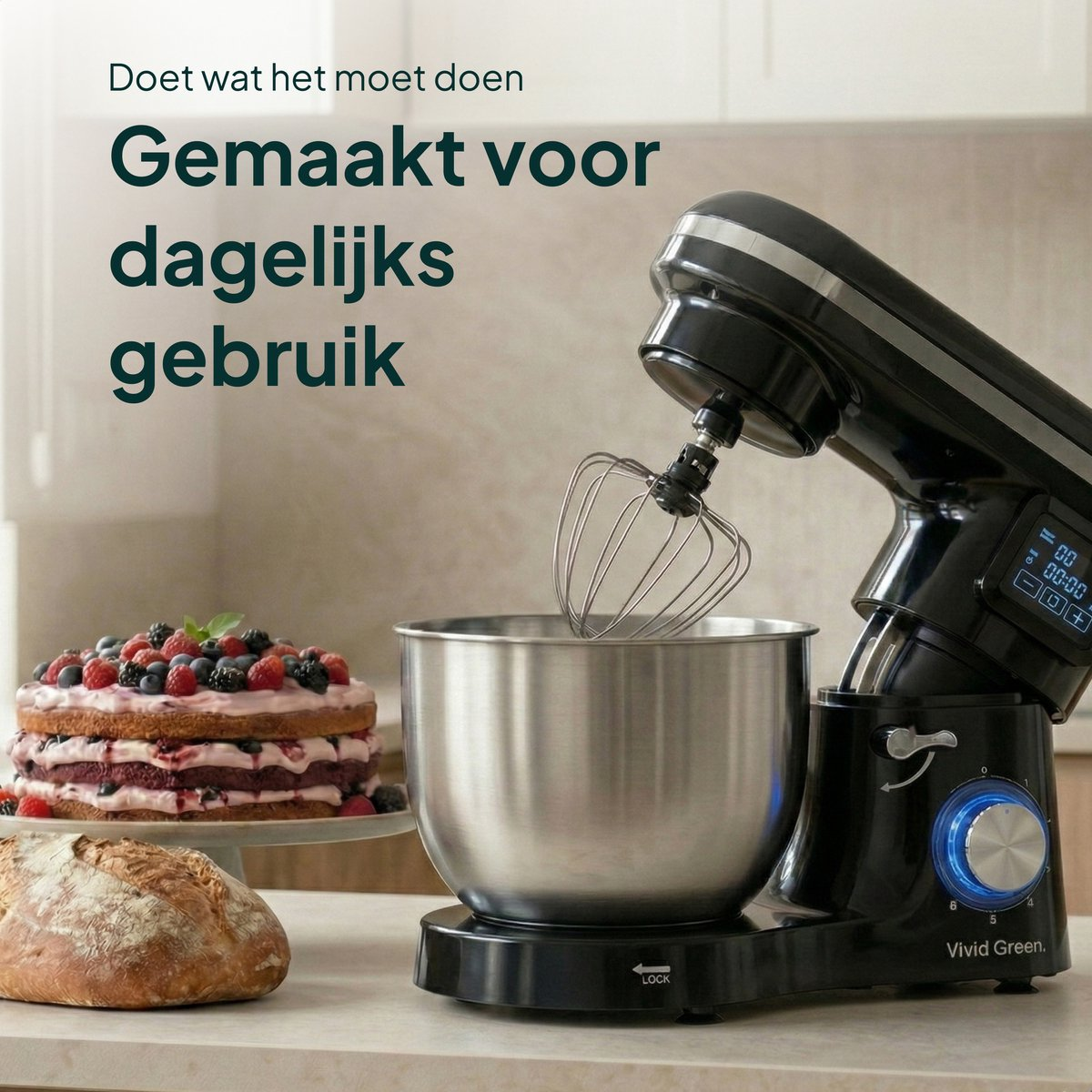 A black stand mixer with a mixing bowl, cake, and bread.
