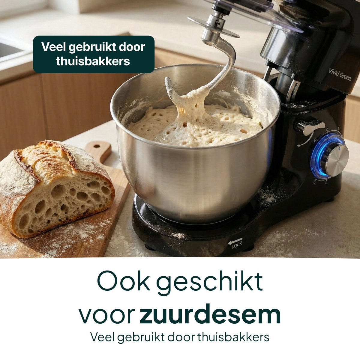 A black kitchen mixer with dough and bread beside it.