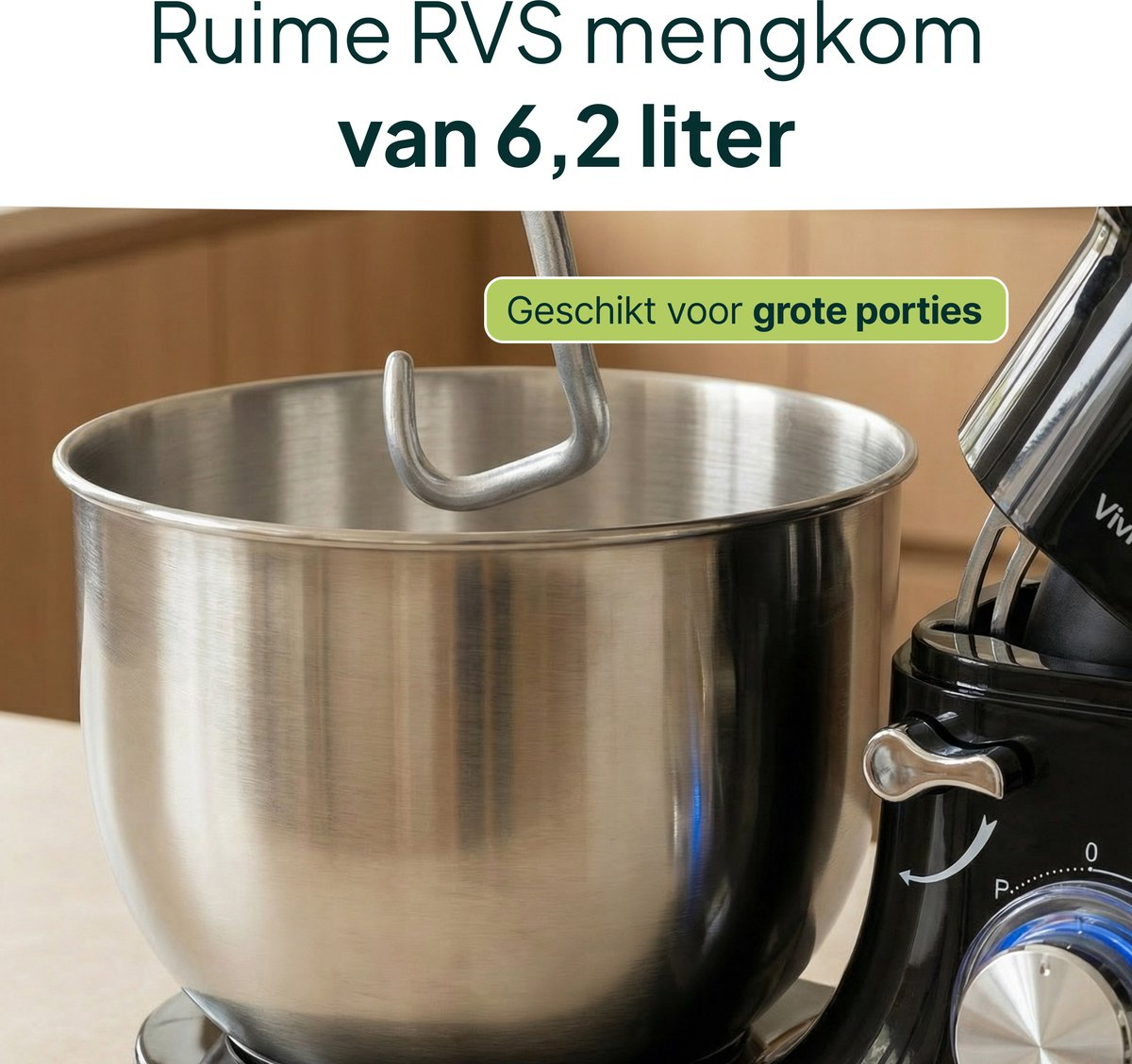 A large stainless steel mixing bowl with a dough hook, part of a black stand mixer.
