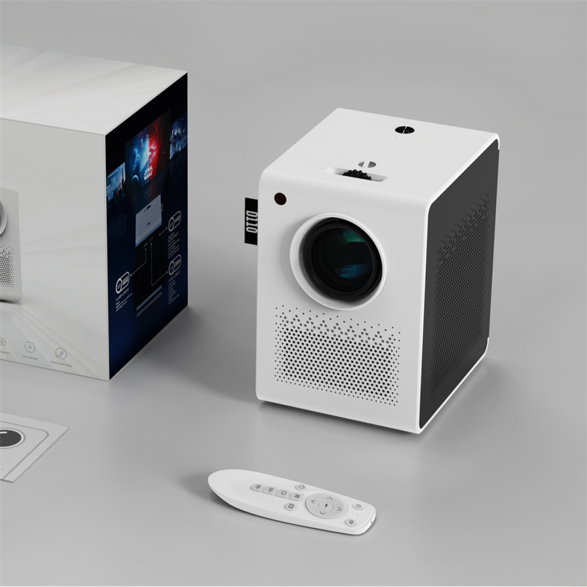 Biały projektor z pilotem i opakowaniem na szarym tle.